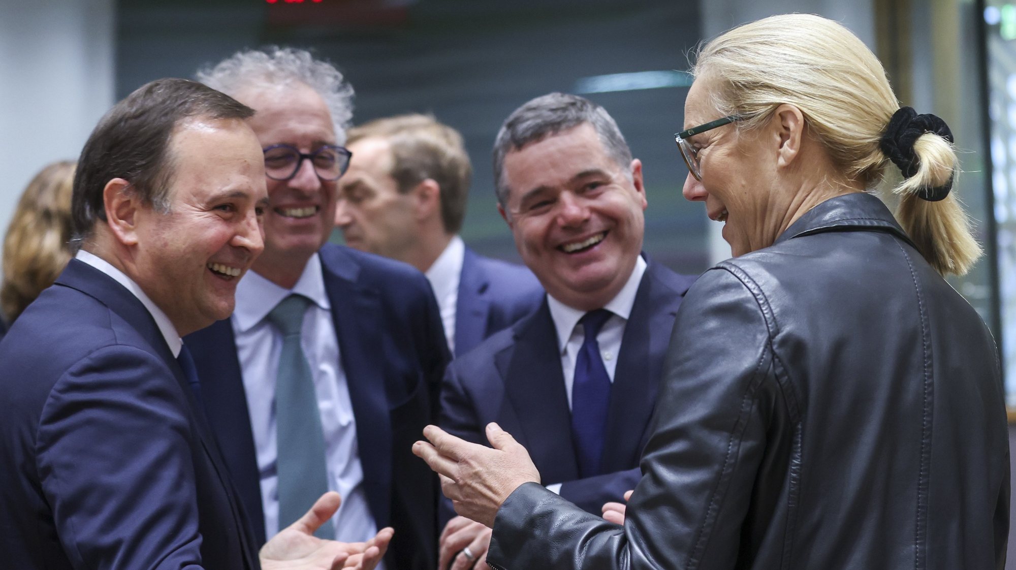epa11015723 (L-R) Portuguese Minister of Finance Fernando Medina, European stability mechanism ESM Managing Director Pierre Gramegna, the President of the Eurogroup Paschal Donohoe and Dutch Finance Minister Sigrid Kaag  chat prior to the start of the  Eurogroup finance ministers meeting in Brussels, Belgium, 07 December 2023. The Eurogroup will discuss the overall budgetary situation and prospects in the euro area and review the economic and fiscal situation of the euro area member states.  EPA/OLIVIER HOSLET