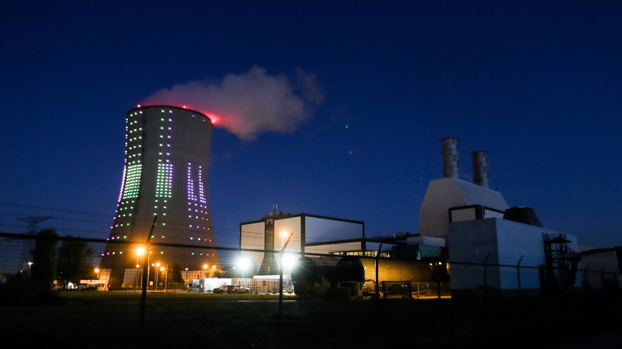 epaselect epa07044043 An exterior view of the Centrale Drogenbos natural gas electricity power plant with its illuminated cooling tower, in Drogenbos, near Brussels, Belgium, 24 September 2018 evening. Belgian energy supplier &#039;Electrabel&#039; had announced on 21 September 2018, that it was pushing back the reactivation of its two Tihange 2 and Tihange 3 nuclear reactors, respectively in March and in June 2019. Three others, also at the stop - Doel 1, 2 and 4, will be relaunched December 10, 31 and 15 respectively. Currently, Belgium only runs two reactors Doel 3 and Tihange 1. But from October 20 to November 29, it will also be stopped to recharge its fuel, resulting in the announcement of a possible shortage of electricity. To secure a sufficient amount of electricity &#039;Electrabel&#039; said they could quickly restart its gas-fired plants in case of a shortage.  EPA/STEPHANIE LECOCQ