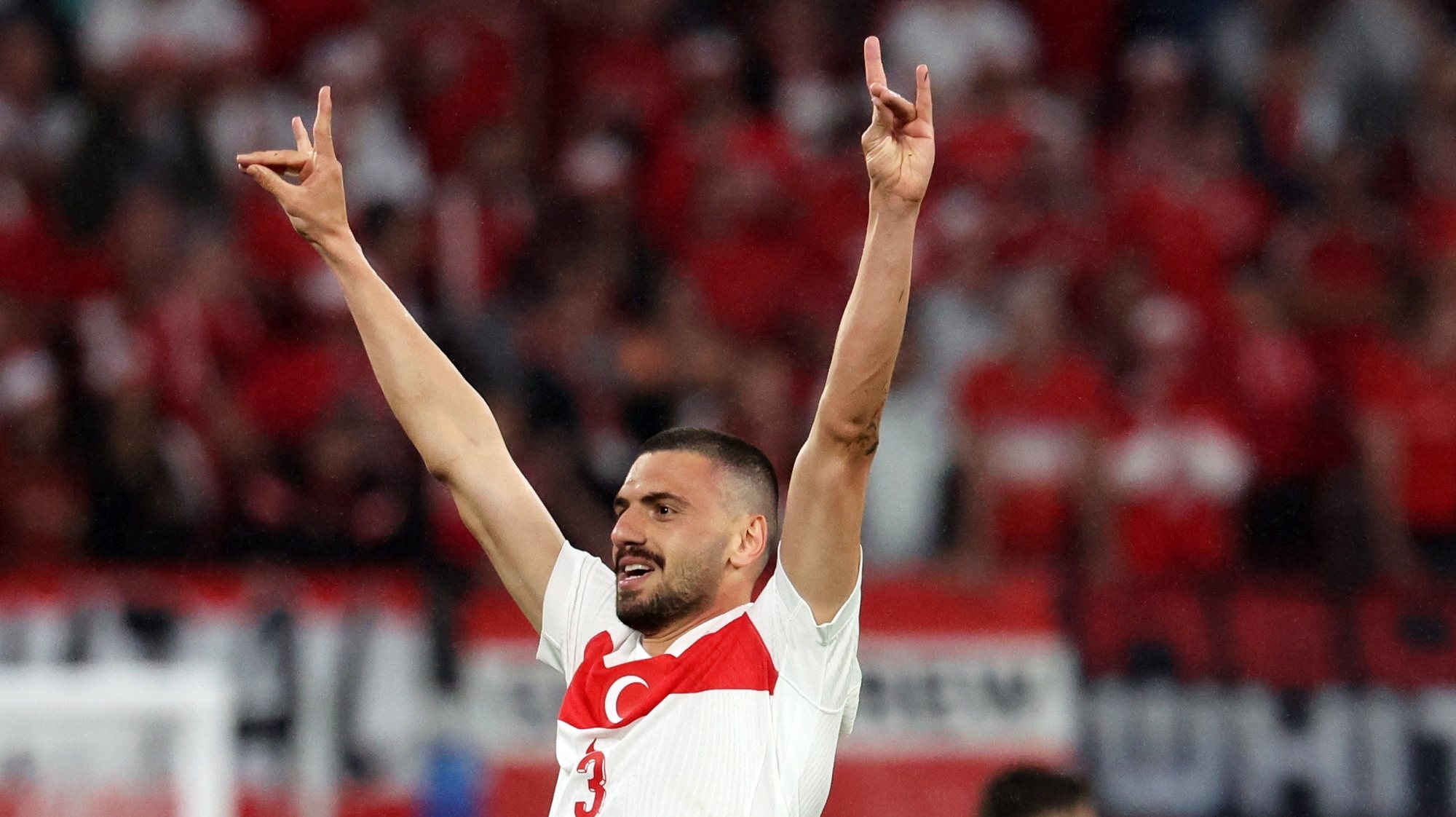 epa11454374 Merih Demiral of Turkey celebrates after scoring his 0-2 second goal during the UEFA EURO 2024 Round of 16 soccer match between Austria and Turkey, in Leipzig, Germany, 02 July 2024 (issued 03 July 2024). The UEFA on 03 July 2024 opened an investigation into &quot;alleged inappropriate behaviour&quot; for the so-called &#039;wolf salute&#039; Demiral gestured, a gesture associated with the far-right nationalist group Grey Wolves.  EPA/ABEDIN TAHERKENAREH