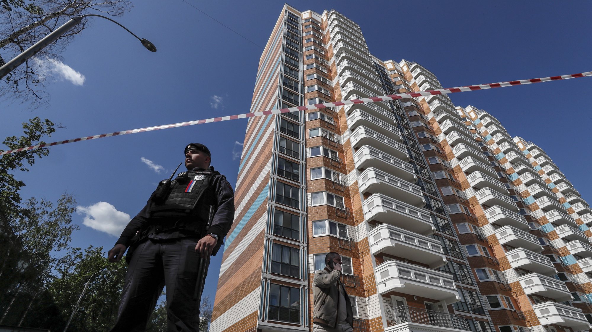 epa10662744 A Russian policeman stands guard near a damaged residential building following a reported drone attack in Moscow, Russia, 30 May 2023. An unmanned aerial vehicle (UAV) attack caused &#039;minor&#039; damage to several buildings and no serious injuries following a drone strike in the Russian capital, Moscow Mayor Sergei Sobyanin wrote on telegram. &#039;This morning, the Kyiv regime launched a terrorist attack with unmanned aerial vehicles on facilities in the city of Moscow&#039;, said the Russian Defence Ministry blaming the attack on Ukraine. The Russian military intercepted eight drones targeting facilities in the city of Moscow, the defense ministry added.  EPA/YURI KOCHETKOV