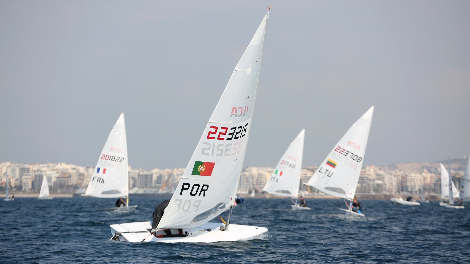 epa11165934 Portuguese Eduardo Marques (C) competes in the 2024 ILCA7 &amp; ILCA 6 Men’s European Championships &amp; Open European Trophy Olympic qualifier for Paris 2024, in the coast city of Alimos, Greece, 19 February 2024.  EPA/ALEXANDROS BELTES