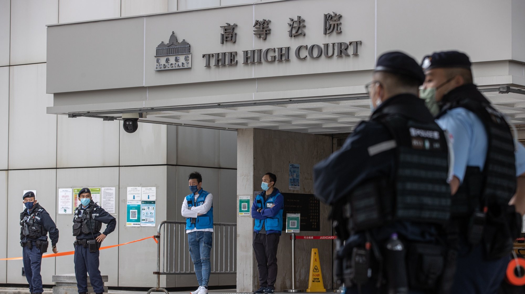 epa10340514 Police stand guard outside the High Court on the first day of the trial under national security law of media tycoon Jimmy Lai Chee-ying in Hong Kong, China, 01 December 2022. Lai is being tried under the national security law for conspiracy to print, publish, sell, offer for sale, distribute, display and/or reproduce seditious publications. Hong Kong Chief Executive John Lee Ka-chiu has asked the National Peopleâ€™s Congress (NPC) Standing Committee, Beijingâ€™s top legislative body, to interpret the cityâ€™s national security law after the Court of Final Appeal upheld a decision allowing a British barrister to defend Lai. The trial has been adjourned to 13 December 2022.  EPA/JEROME FAVRE
