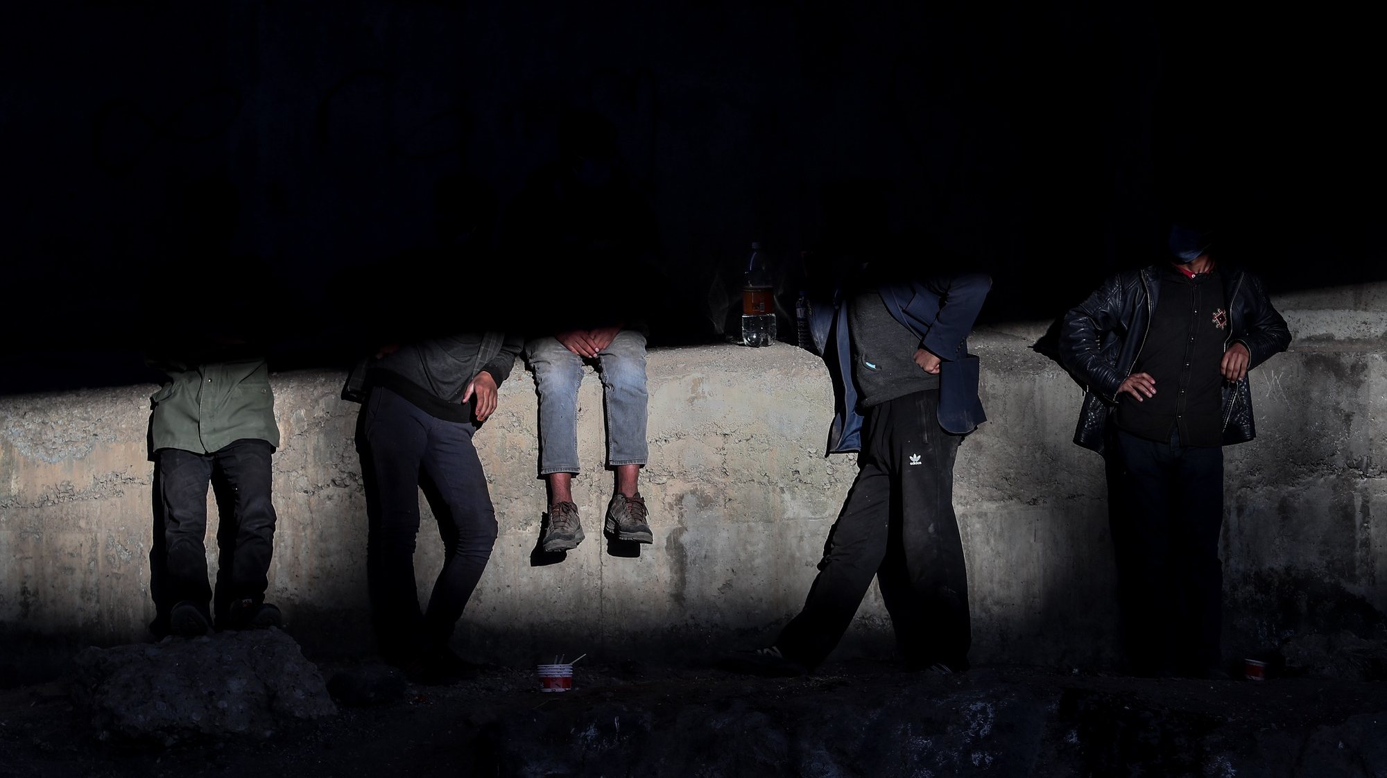 epaselect epa09323135 (28/33) A group of people rest under a bridge near a railway in the Turkish city of Van after crossing the Iran-Turkey border, 02 June 2021. People smuggled into the country wait for days to be transferred by smugglers to Diyarbakir city to reach west Turkey. The city of Van, on the Turkish-Iranian border, is one of the points at which human smuggling can be easily spotted. Smugglers charge between 600 or 1,000 US dollars per person, depending on the security situation at the border.  EPA/SEDAT SUNA ATTENTION: For the full PHOTO ESSAY text please see Advisory Notices epa09323103 and epa09323104