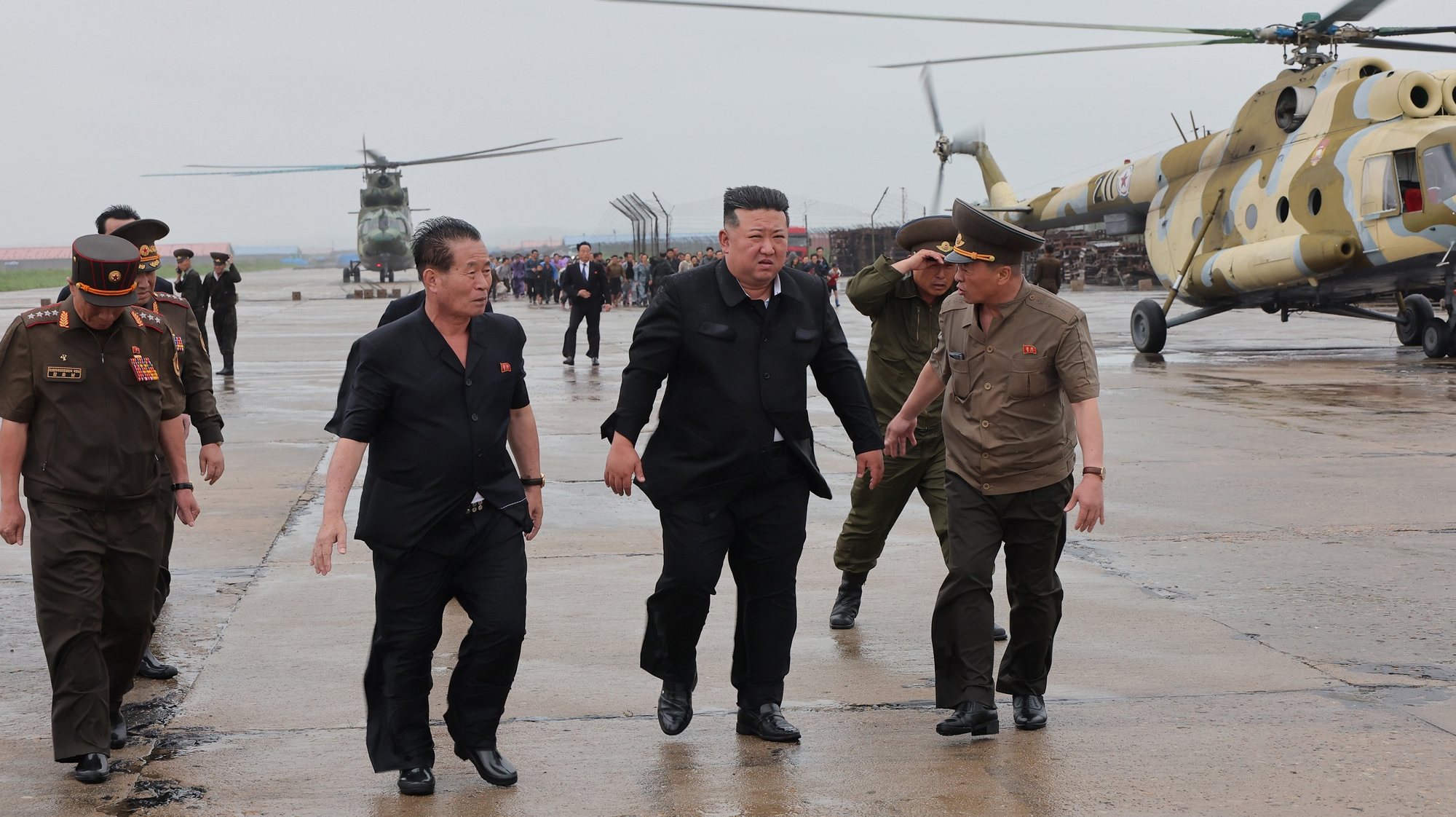 epa11504803 A photo released by the official North Korean Central News Agency (KCNA) shows North Korean leader Kim Jong Un (C) inspecting a flood-hit area in North Phyongan Province, North Korea, 28 July 2024 (issued 29 July 2024). According to KCNA, a record downpour hit the northern border of North Korea and China on 27 July caused the water level of the Amnok River to far exceed the danger line, affecting more than 5,000 inhabitants in several islet areas of Sinuiju City and Uiju County of North Phyongan Province.  EPA/KCNA  EDITORIAL USE ONLY