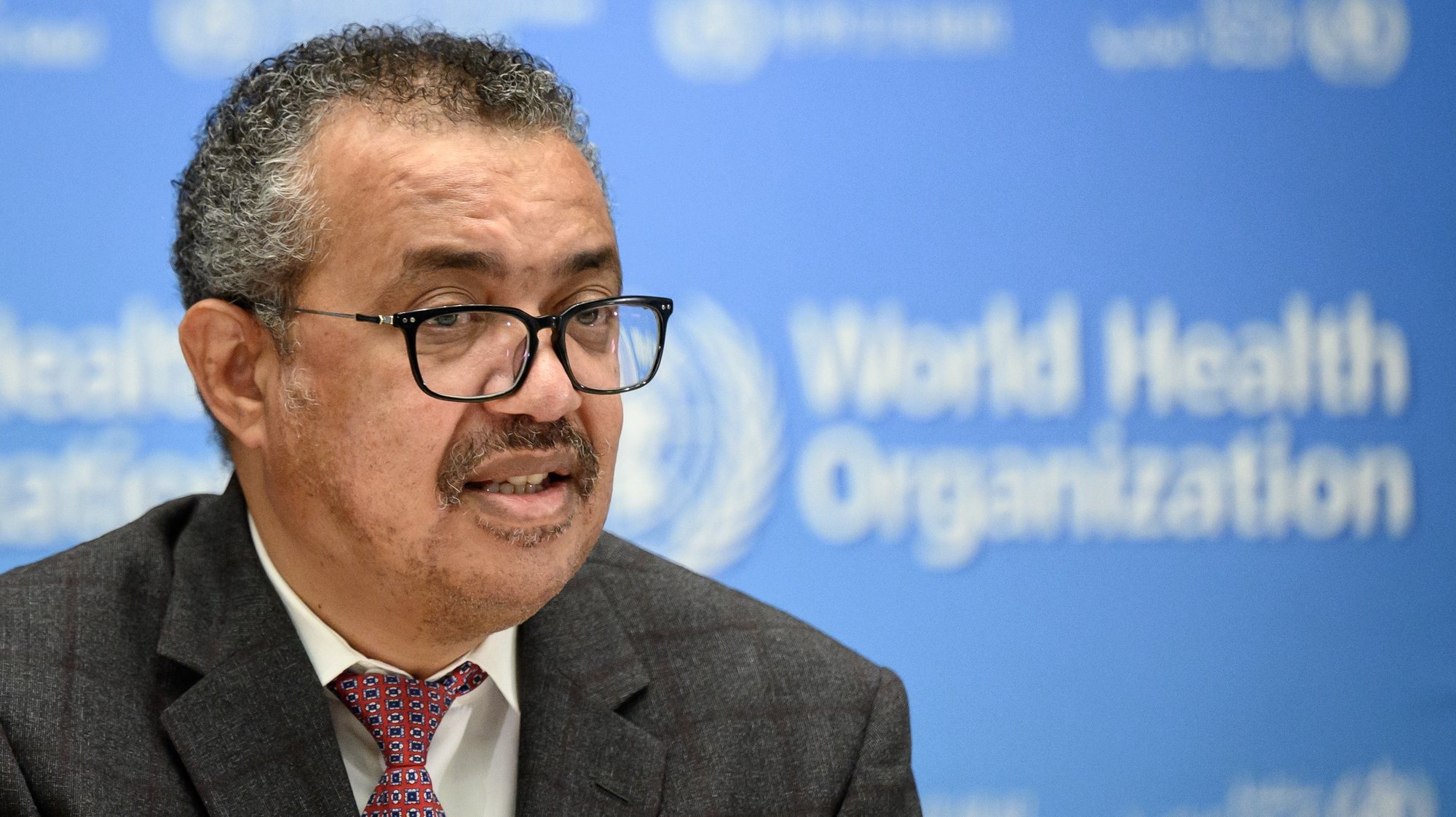 epa09529942 World Health Organization (WHO) Director-General Tedros Adhanom Ghebreyesus delivers a speech during the launch of a multiyear partnership with Qatar on making the FIFA Football World Cup 2022 and mega sporting events healthy and safe, at the WHO headquarters in Geneva, Switzerland,  18 October 2021.  EPA/FABRICE COFFRINI / POOL