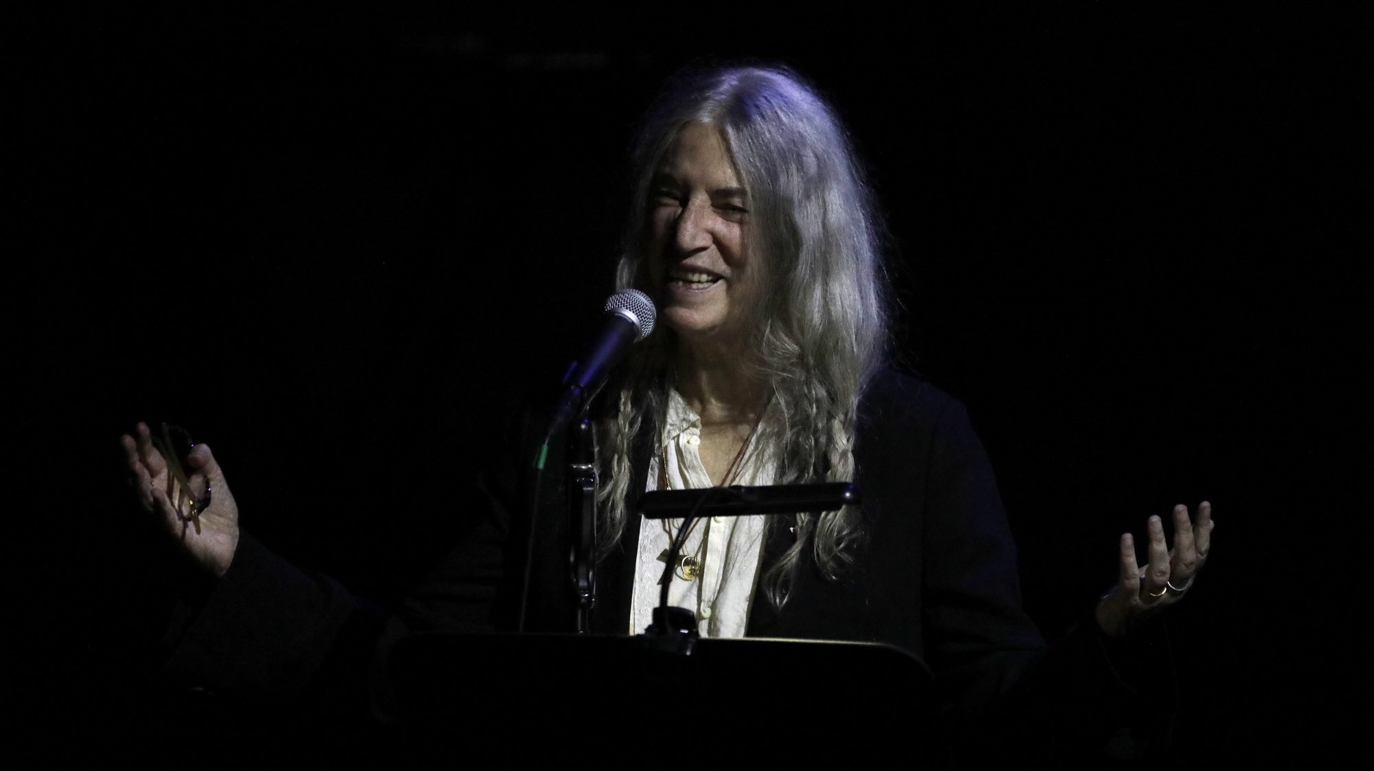 epa10768689 US artist Patti Smith performs in concert along with Soundwalk Collective, at the Teatro Colon in Bogota, Colombia, 25 July 2023.  EPA/Carlos Ortega