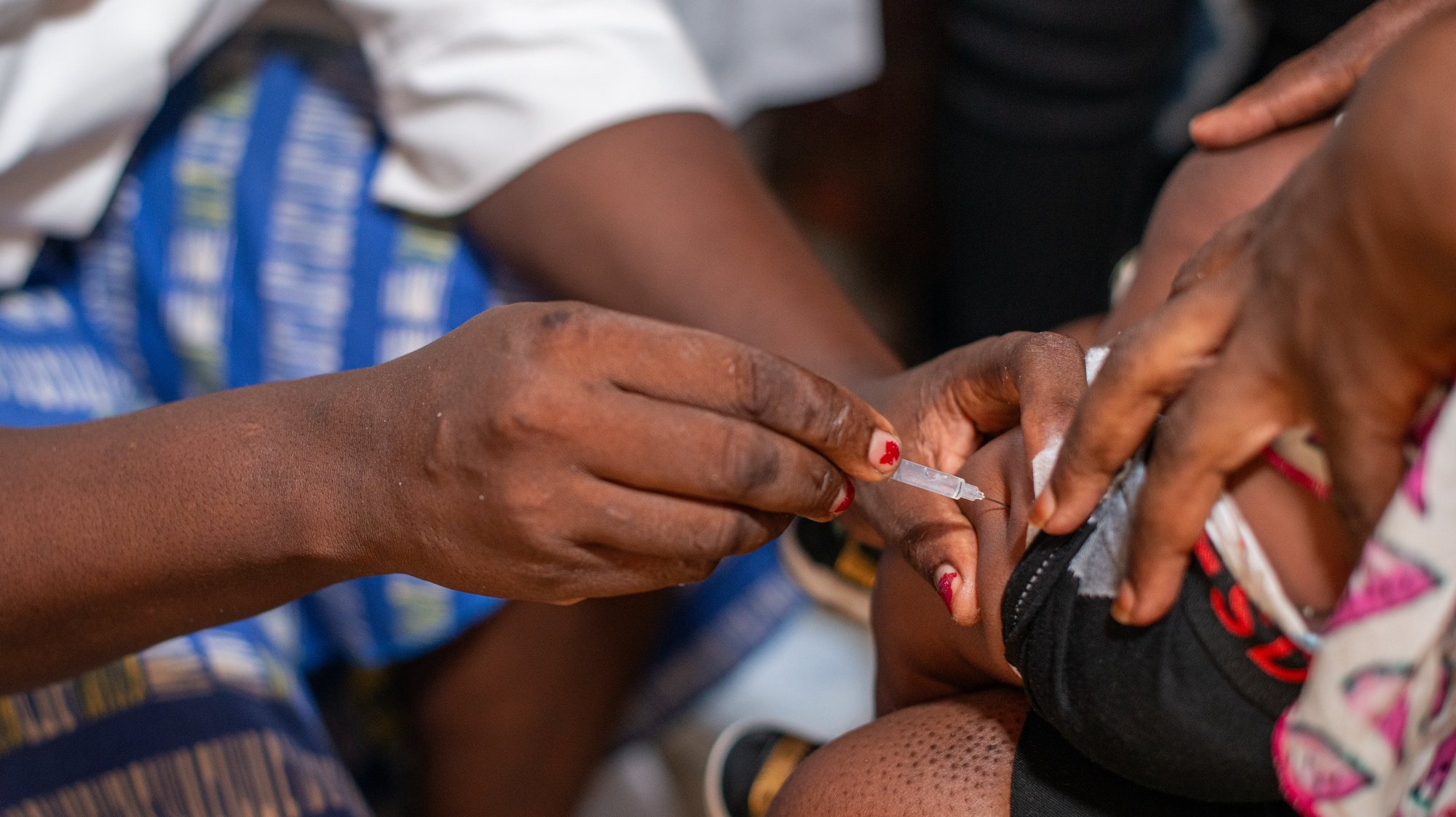 epa11096741 A nurse vaccinates a child against malaria in Nyalla Medical Centre in Douala, Cameroon, 22 January 2024. A new malaria vaccine, known as RTS,S, or Mosquirix, made by GlaxoSmithKline, is being rolled out for the first time as an immunization campaign for children in Cameroon. According to the World Health Organisation, the WHO African Region, with an estimated 233 million cases in 2022, accounted for about 94% of cases globally. Malaria is highly endemic in Cameroon and the WHO estimates that about 11,000 people die from malaria in Cameroon every year.  EPA/DONGMO RODRIGUE WILLIAM