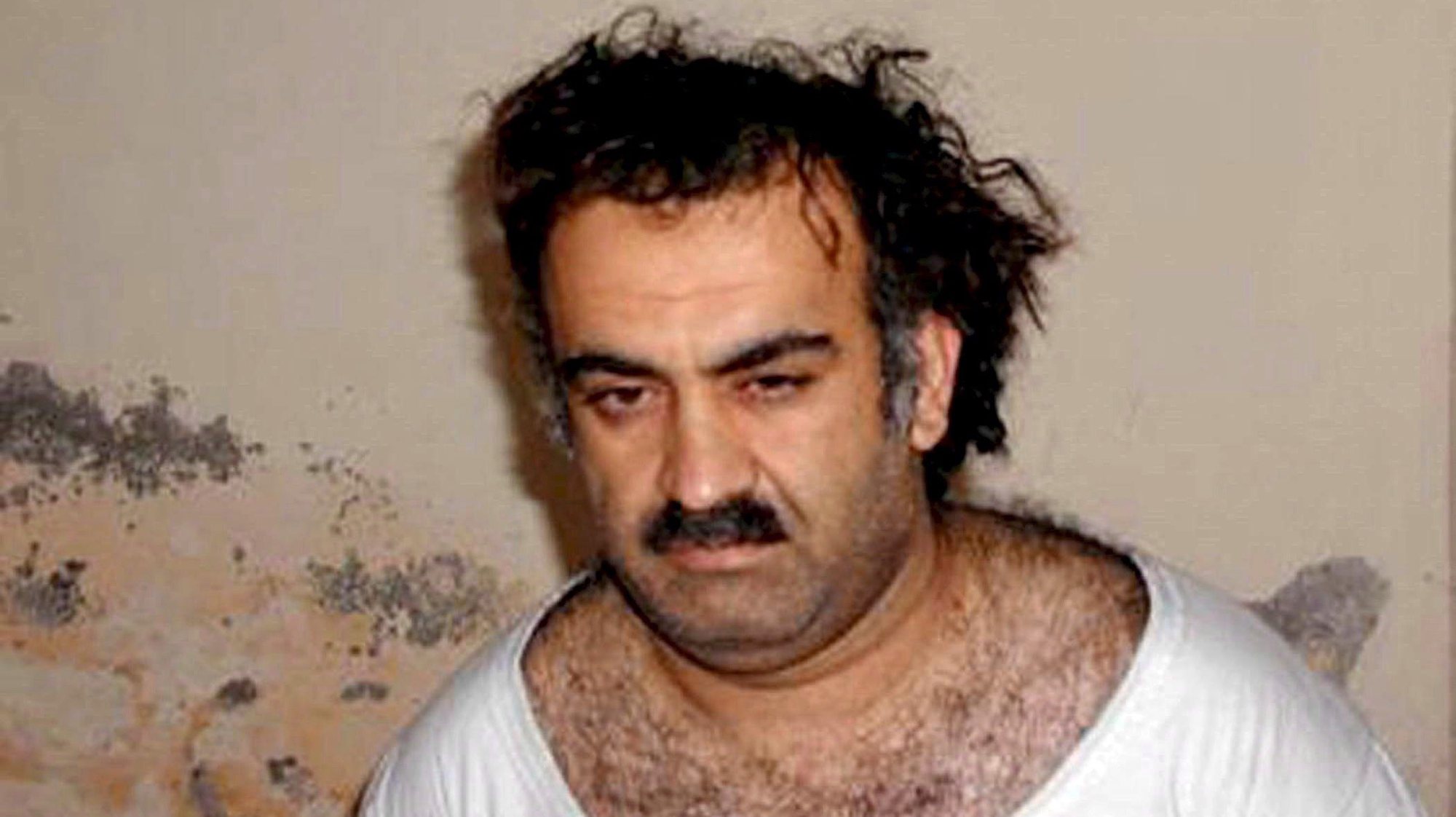 epa03206657 (FILE) A handout photo obtained 01 March 2003, showing Al-Qaeda operative Khalid Sheikh Mohammed shortly after his capture, in Rawalpindi, Pakistan. A group of five alleged terrorists, Ramzi Binalshibh, Ali Abdul Aziz Ali, Mustafa Ahmed al-Hawsawi and Walid bin Attas, led by alleged mastermind Khalid Sheikh Mohammed are to appear before a military tribunal in Guantanamo 05 May 2012 to hear the charges against them. According to the Pentagon, the charges related to 11 September 2001 terrorist attacks in USA include terrorism, hijacking aircraft, conspiracy, murder, attacking civilians, intentionally causing serious bodily injury and destruction of property.  EPA/HANDOUT  HANDOUT EDITORIAL USE ONLY/NO SALES *** Local Caption *** 00000402670123