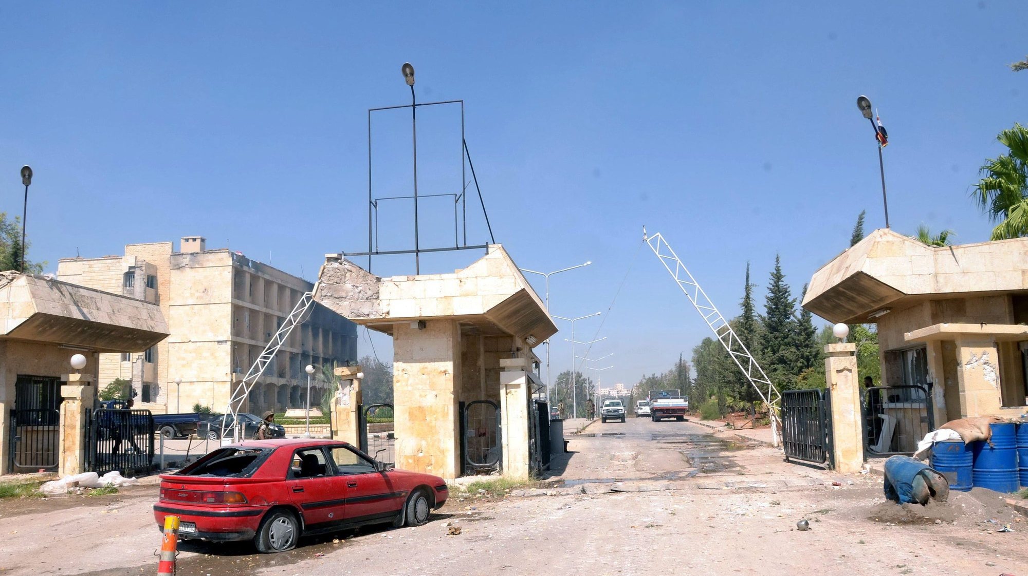 epa03401056 A handout photo made available by Syrian Official News Agency (SANA) shows the damaged entrance of the Scientific Research Center, at al-Zahraa district in Aleppo, in northern Syria, 17 September 2012. According to activists more than 50 people were killed in violence across the country on 17 September mainly in the northern provinces of Aleppo and Idlib.  EPA/SANA HANDOUT  HANDOUT EDITORIAL USE ONLY/NO SALES