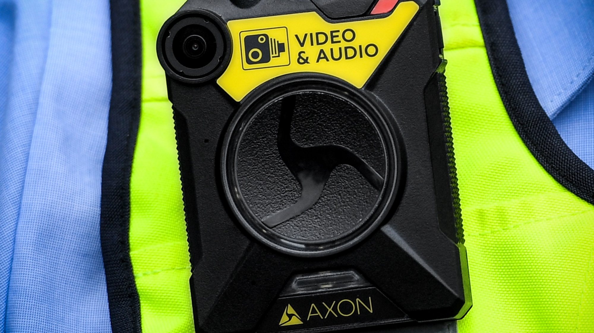 epa07868790 Police officers present new introduced bodycams (L) for North Rhine-Westphalian police in Cologne, Germany, 25 September 2019. The de-escalating effect of the bodycams is intended to protect police officers from attacks in patrol service.  EPA/SASCHA STEINBACH