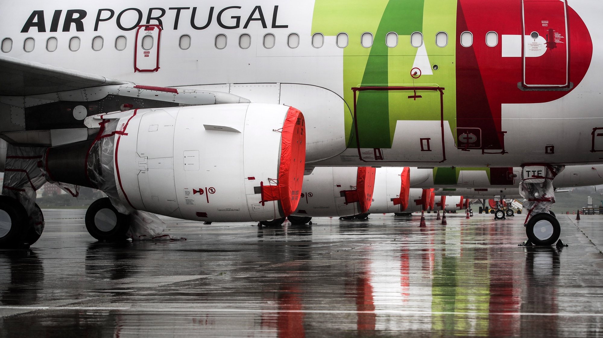 File photo dated from 09 April 2020 of TAP aircraft engines cover with plastic foil remain grounded at Humberto Delgado airport closed for passenger traffic as part of the exceptional traffic measures to combat the epidemiological situation of Covid-19, in Lisbon, Portugal, 09 April 2020 (reissued 02 July 2020). The granting of state support to TAP has been under discussion since the airline&#039;s activity came to a standstill because of the coronavirus pandemic, with an agreed injection of up to 1,200 million euros. MARIO CRUZ/LUSA