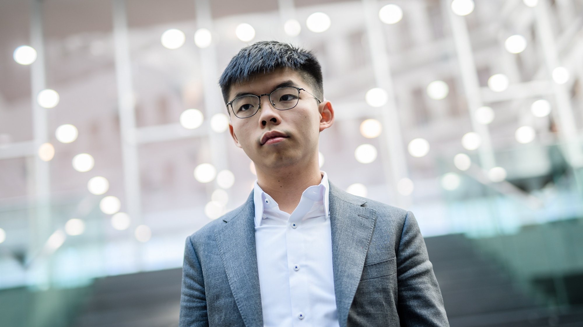 epa08692656 (FILE) - Hong Kong Demosisto party Secretary General and pro-democracy activist Joshua Wong poses for media after a press conference at the Federal Press Conference (Bundespressekonferenz) in Berlin, Germany, 11 September 2019 (reissued 24 September 2020). According to media reports, Wong was arrented on 24 September 2020 while reporting to Central Police Station in Hong Kong, on charges of participating in an unlawful assembly on 05 October 2019, as well as violating the anti-mask law.  EPA/CLEMENS BILAN