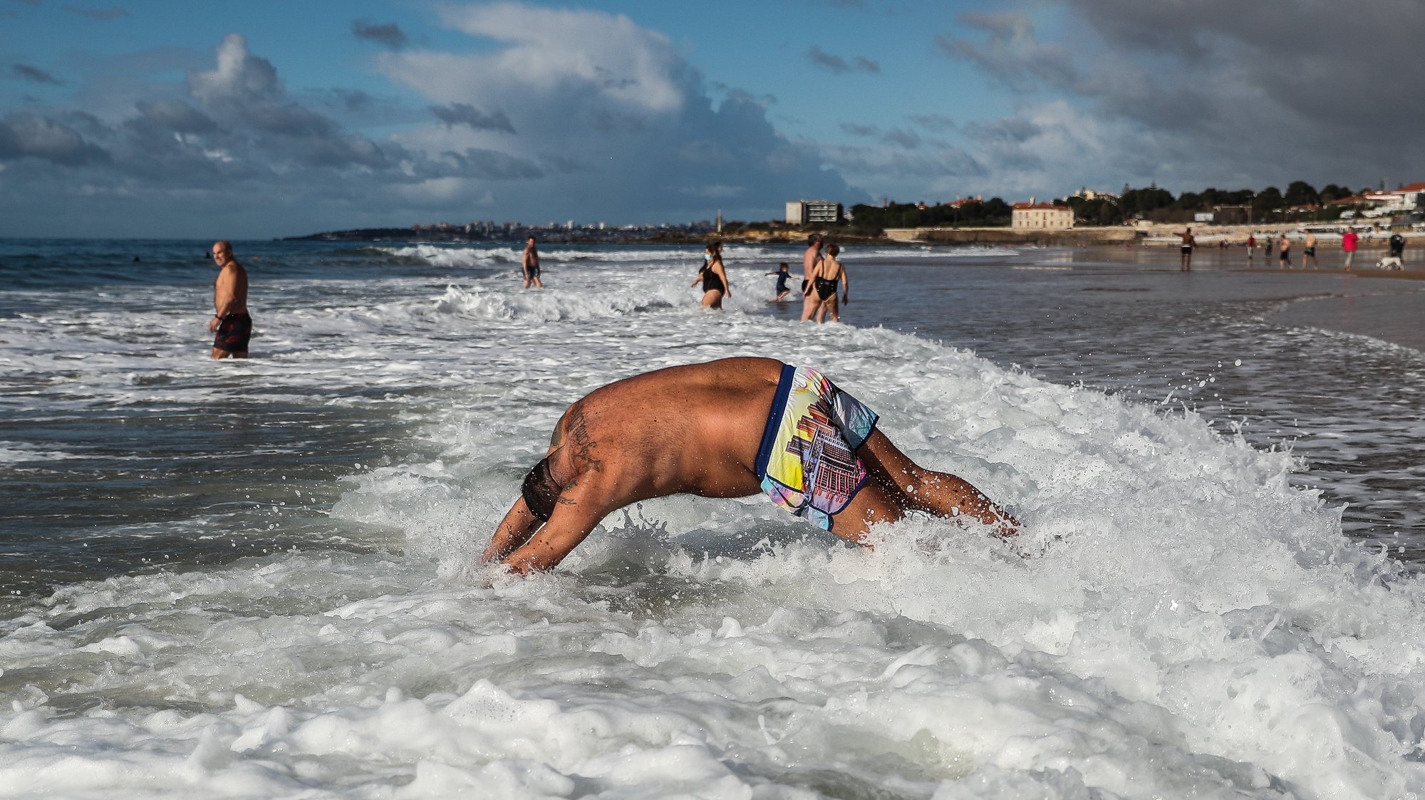 A man takes his first bath of the year during the New Year&#039;s celebrations at Carcavelos beach in Cascais, outskirts of Lisbon, Portugal, 01 January 2021. MÁRIO CRUZ/LUSA