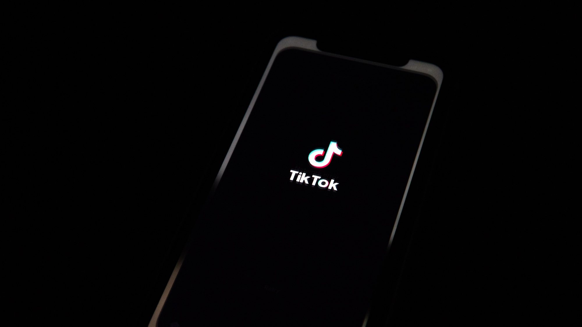 epa08685858 A generic illustration shows the logo of Chinese internet media app TikTok on a phone, in Beijing, China, 21 September 2020.  Chinese-owned mobile app WeChat was set to stop operation in the U.S. on midnight 20 September 2020.  EPA/ROMAN PILIPEY
