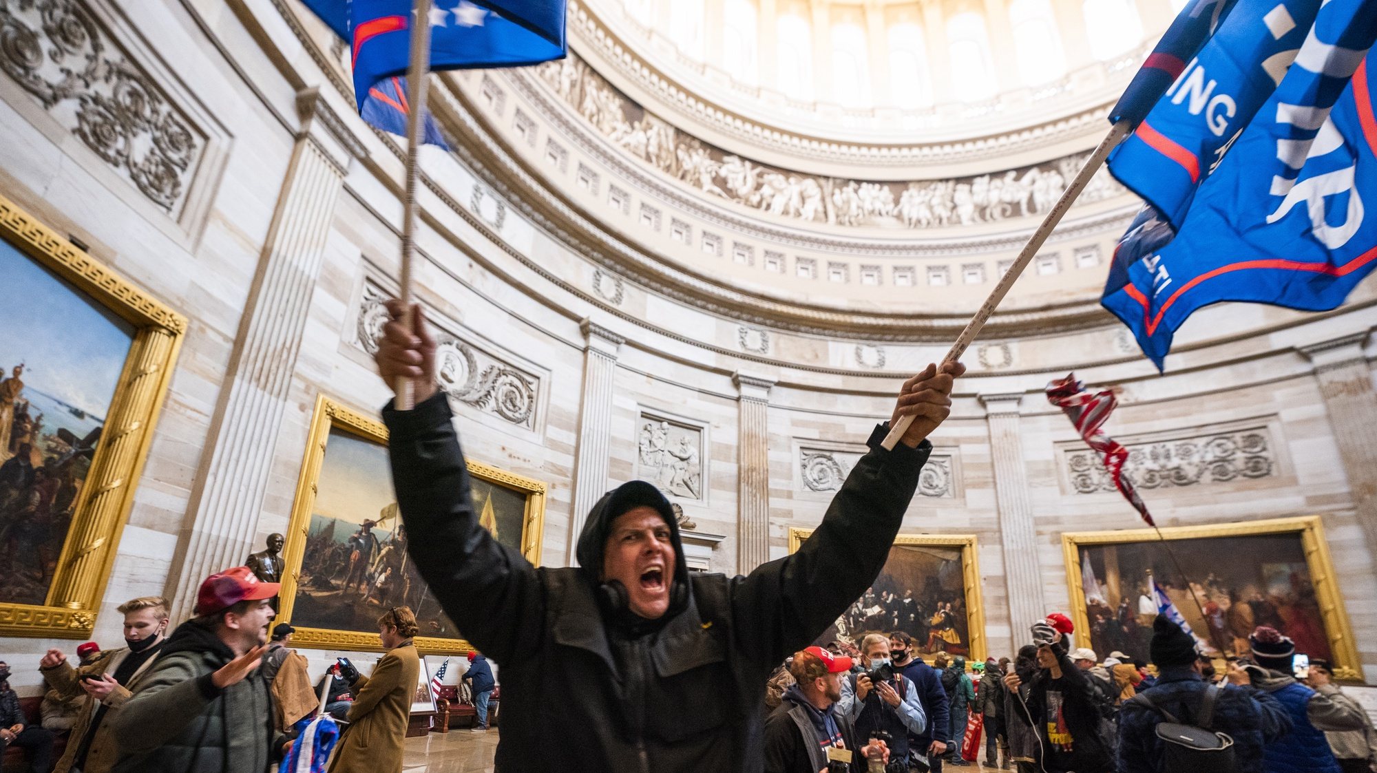 epaselect epa08923451 Supporters of US President Donald J. Trump in the Capitol Rotunda after breaching Capitol security in Washington, DC, USA, 06 January 2021. Protesters entered the US Capitol where the Electoral College vote certification for President-elect Joe Biden took place.  EPA/JIM LO SCALZO