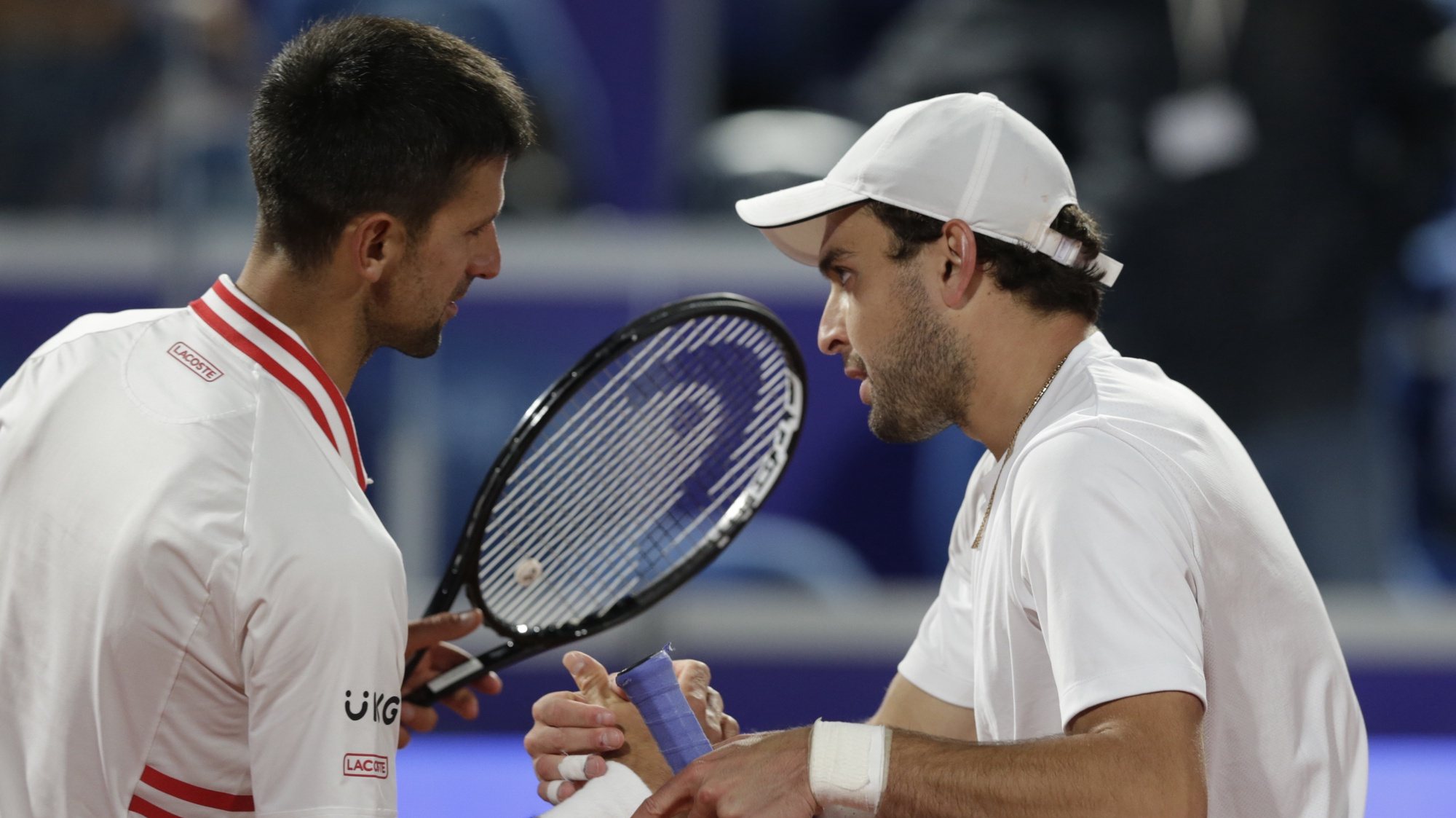 epa09157385 Aslan Karatsev of Russia (R) shakes hands with Novak Djokovic of Serbia after their semi final match at the Serbia Open tennis tournament in Belgrade, Serbia, 24 April 2021.  EPA/ANDREJ CUKIC