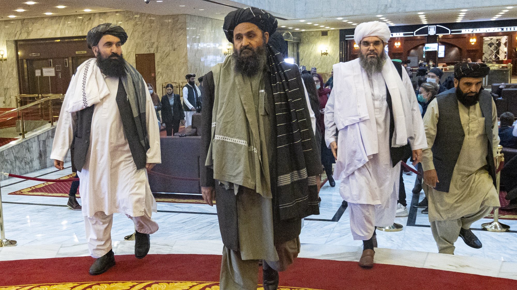 epa09082251 Taliban co-founder Mullah Abdul Ghani Baradar (C) arrives with other members of the Taliban delegation for attending an international peace conference in Moscow, Russia, 18 March 2021. Russia is hosting a peace conference for Afghanistan, bringing together government representatives and their Taliban adversaries along with regional observers in a bid to help jump-start the country&#039;s stalled peace process. The one-day gathering Thursday is the first of three planned international conferences ahead of a May 1 deadline for the final withdrawal of U.S. and NATO troops from the country, a date fixed under a year-old agreement between the Trump administration and the Taliban.  EPA/ALEXANDER ZEMLIANICHENKO / POOL