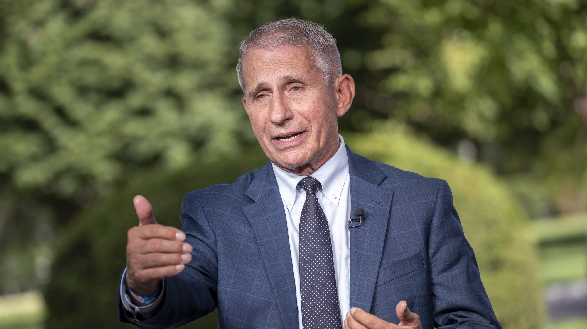 epa09419588 Anthony Fauci, director of the US National Institute of Allergy and Infectious Diseases (NIAID) participates in a television interview at the White House in Washington, DC, USA, 18 August 2021. President Biden said top federal health officials recommend that all Americans get a booster shot eight months after becoming fully vaccinated against COVID-19.  EPA/SHAWN THEW