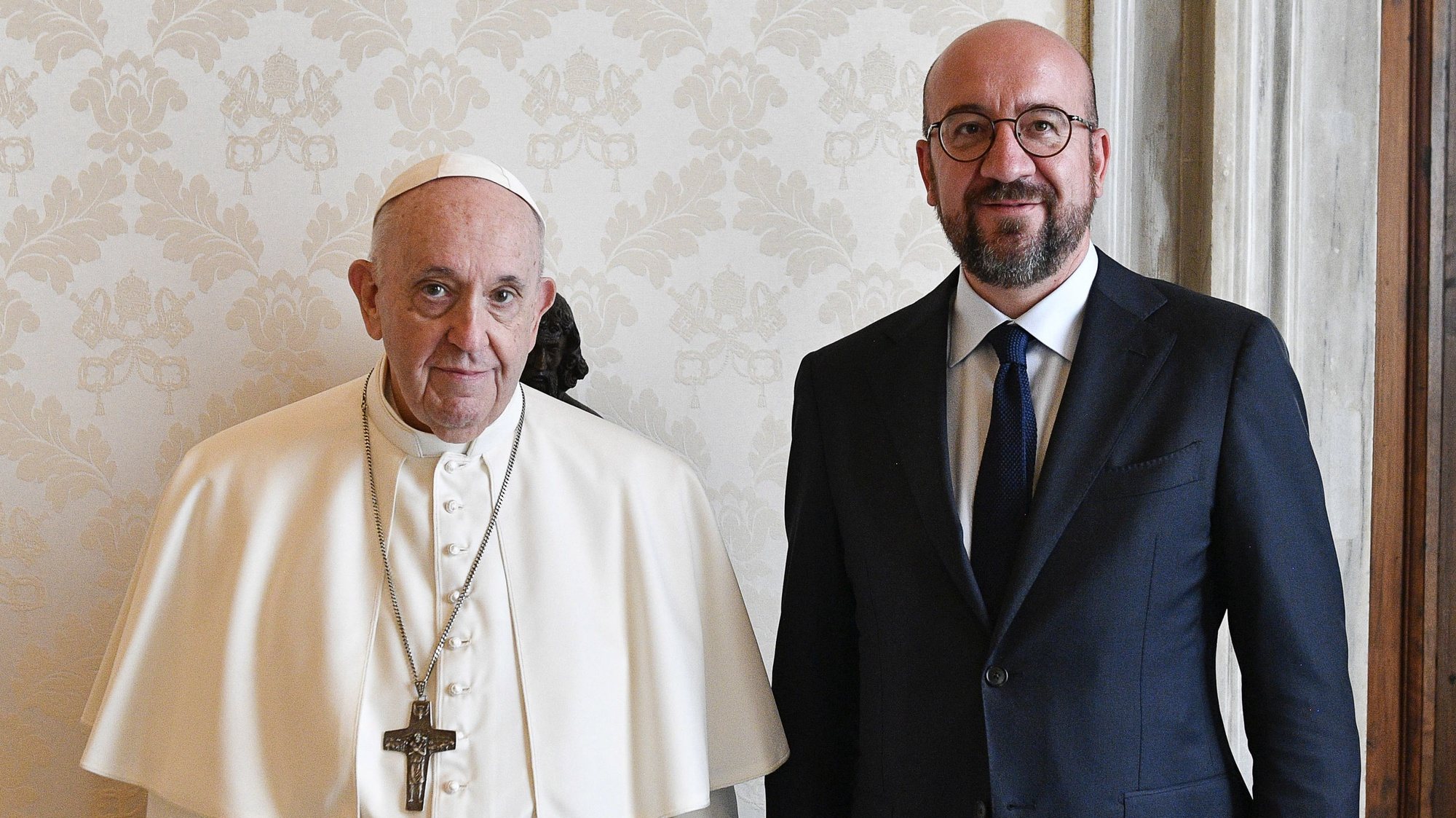 epa09460685 A handout picture provided by the Vatican Media shows Pope Francis (L) and European Council President Charles Michel (R) posing for a photograph during their meeting in Vatican City, 11 September 2021.  EPA/VATICAN MEDIA HANDOUT  HANDOUT EDITORIAL USE ONLY/NO SALES