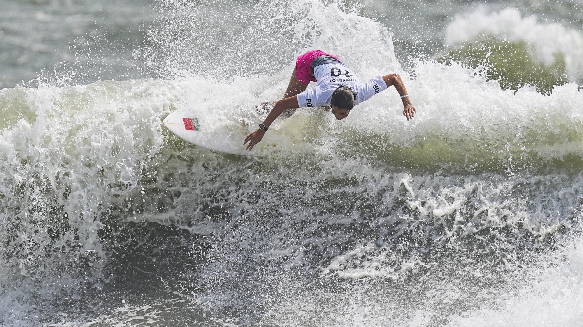 epa09365967 Teresa Bonvalot from Portugal surfs during the Women&#039;s Round 3 of the Surfing events of the Tokyo 2020 Olympic Games at the Tsurigasaki Surfing​ Beach in Ichinomiya, Japan, 26 July 2021.  EPA/NIC BOTHMA