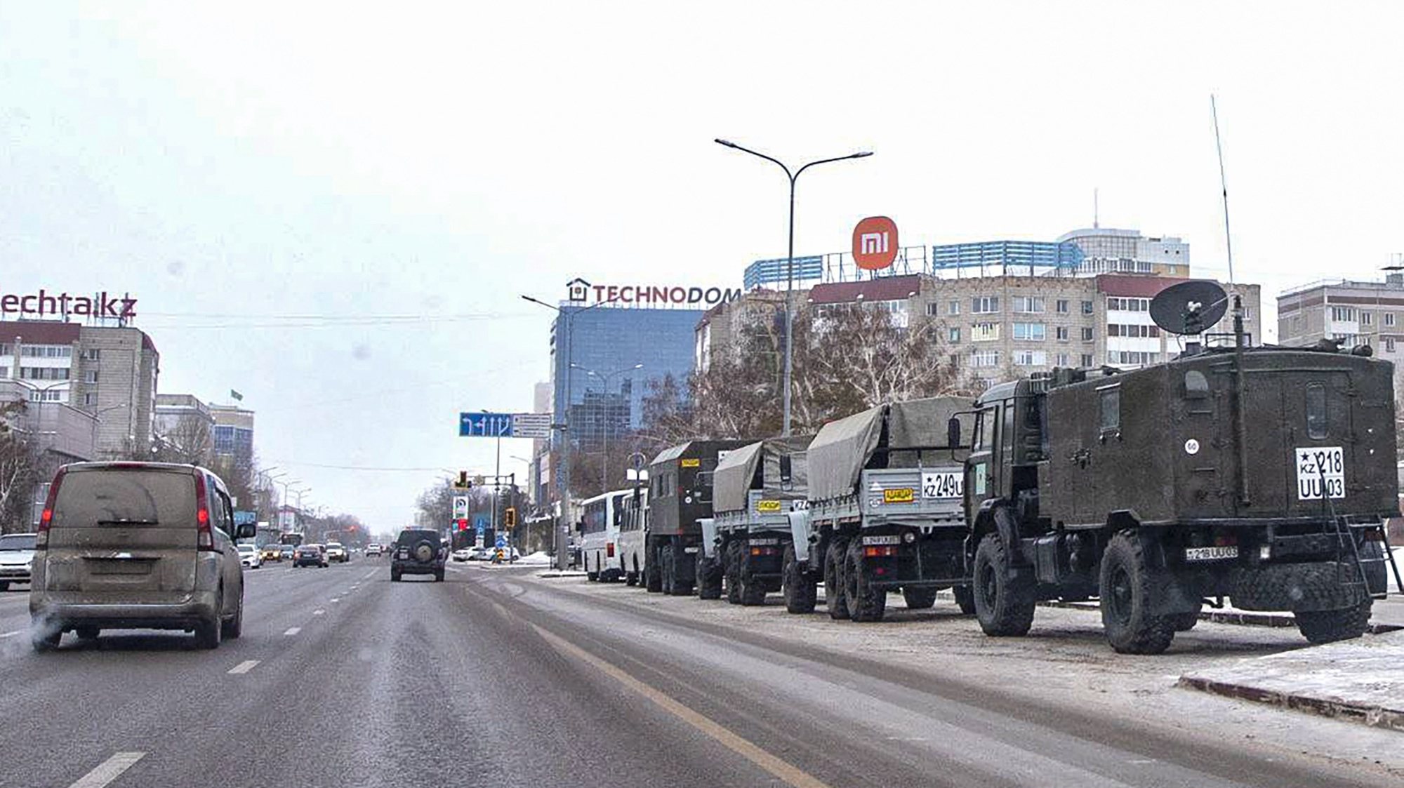 epa09672799 Kazakh military vehicles (R) stand at an area in downtown Nur-Sultan, the capital city of Kazakhstan, 08 January 2022. Mass protests erupted in the Central Asian country in the first days of 2022, amid the discontent of the residents of the cities of Zhanaozen and Aktau in the west of the country after the rise in prices of liquefied petroleum gas (LPG), which is widely used to refuel cars. Subsequently, protesters took to the streets in other cities, where several clashes with security forces made victims from all sides. Kazakh President Tokayev dismissed the government and ordered the introduction of regulation of selling prices for fuel, but the unrest continued. He also headed a Security Council, at the first meeting of which he called the situation in Kazakhstan &#039;undermining the integrity of the state&#039; and said that he had turned to the Collective Security Treaty Organization (CSTO) for help. During the riots, members of the CSTO organization sent collective peacekeeping forces to the country at the request of the Kazakh president.  EPA/RADMIR FAHRUTDINOV