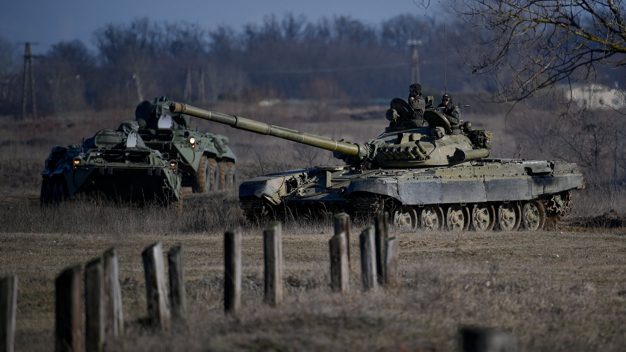 epa09782310 A T-72 battle tank and an armoured vehicle are seen at the Vay Adam training ground near Hajduhadhaz, Hungary 24 February 2022. Hungarian troops are being deployed to the eastern part of the country near the Ukrainian border both for national security reasons and humanitarian aid after Russian troops launched a major military operation on Ukraine on 24 February.  EPA/Zsolt Czegledi HUNGARY OUT