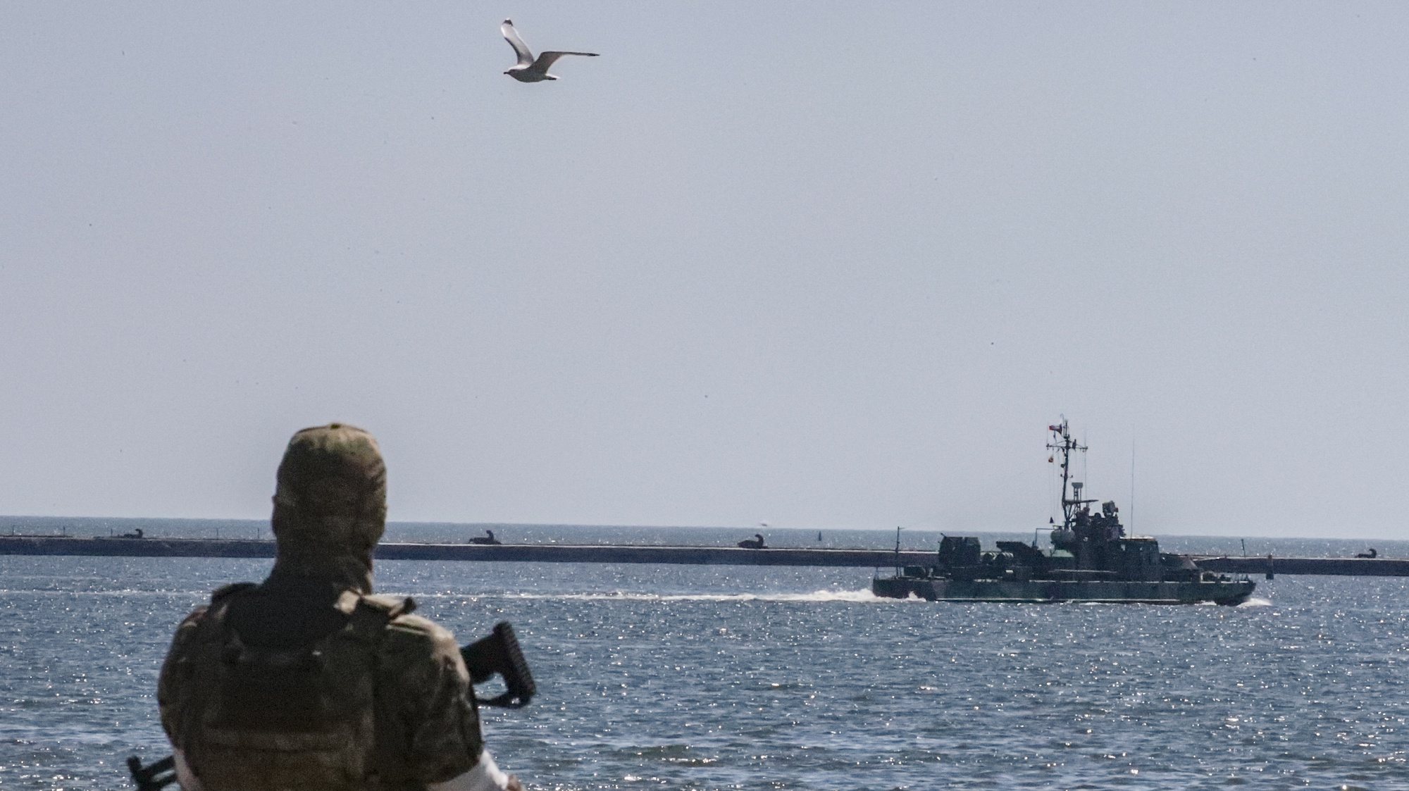 epa10009896 A picture taken during a visit to Mariupol organized by the Russian military shows a Russian navy ship sails in the waters of the cargo sea port of Mariupol, Ukraine, 12 June 2022.  Russian Defense Minister Sergei Shoigu said the seaports of Mariupol and Berdyansk in Ukraine are operating normally and are ready to ship grain.  According to Shoigu, demining of the Mariupol seaport has been completed and it is functioning normally and has received the first cargo ships. Shoigu added ‘In Mariupol, water and electricity supply to residential areas are gradually being restored, streets are being cleared, the first social facilities have begun to function.’ On 24 February Russian troops entered Ukrainian territory starting a conflict that has provoked destruction and a humanitarian crisis. According to the UNHCR, more than six million refugees have fled Ukraine, and a further 7.7 million people have been displaced internally within Ukraine since.  EPA/SERGEI ILNITSKY