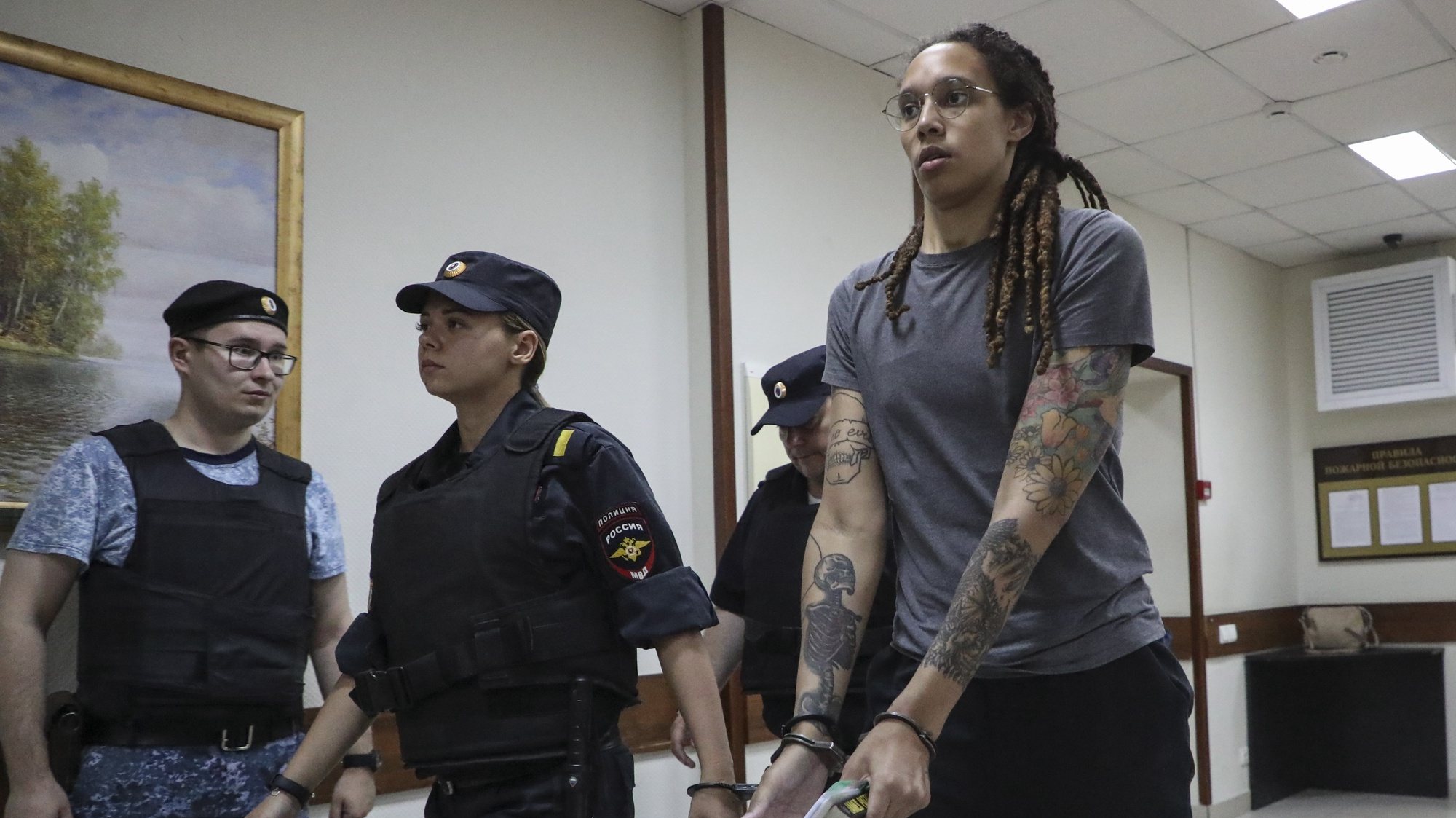 epa10105913 Two-time Olympic gold medalist and WNBA player Brittney Griner (C) is escorted to hear the court&#039;s verdict in Khimki City court in Khimki outside Moscow, Russia, 04 August 2022. The Khimki City Court has sentenced Griner to nine years in prison after finding her guilty on charges of drug smuggling.  EPA/MAXIM SHIPENKOV