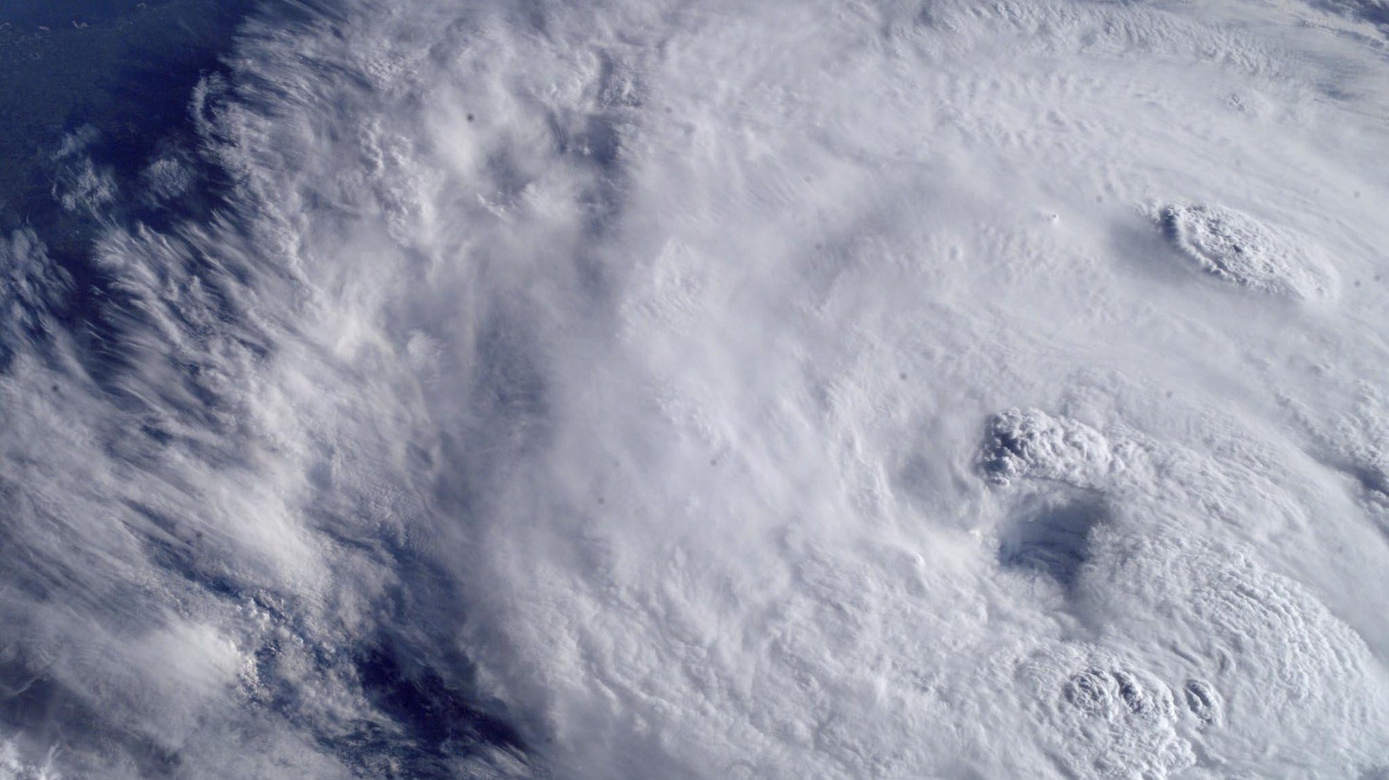This NASA image released 16 July, 2003 captured 15 July by the crew on board the International Space Station,  shows Hurricane Claudette. Claudette has been blamed for at least two deaths and caused considerable damage along the Texas gulf coast before being downgraded to a tropical depression. The eye of the storm can be seen left of center. AFP PHOTO/NASA