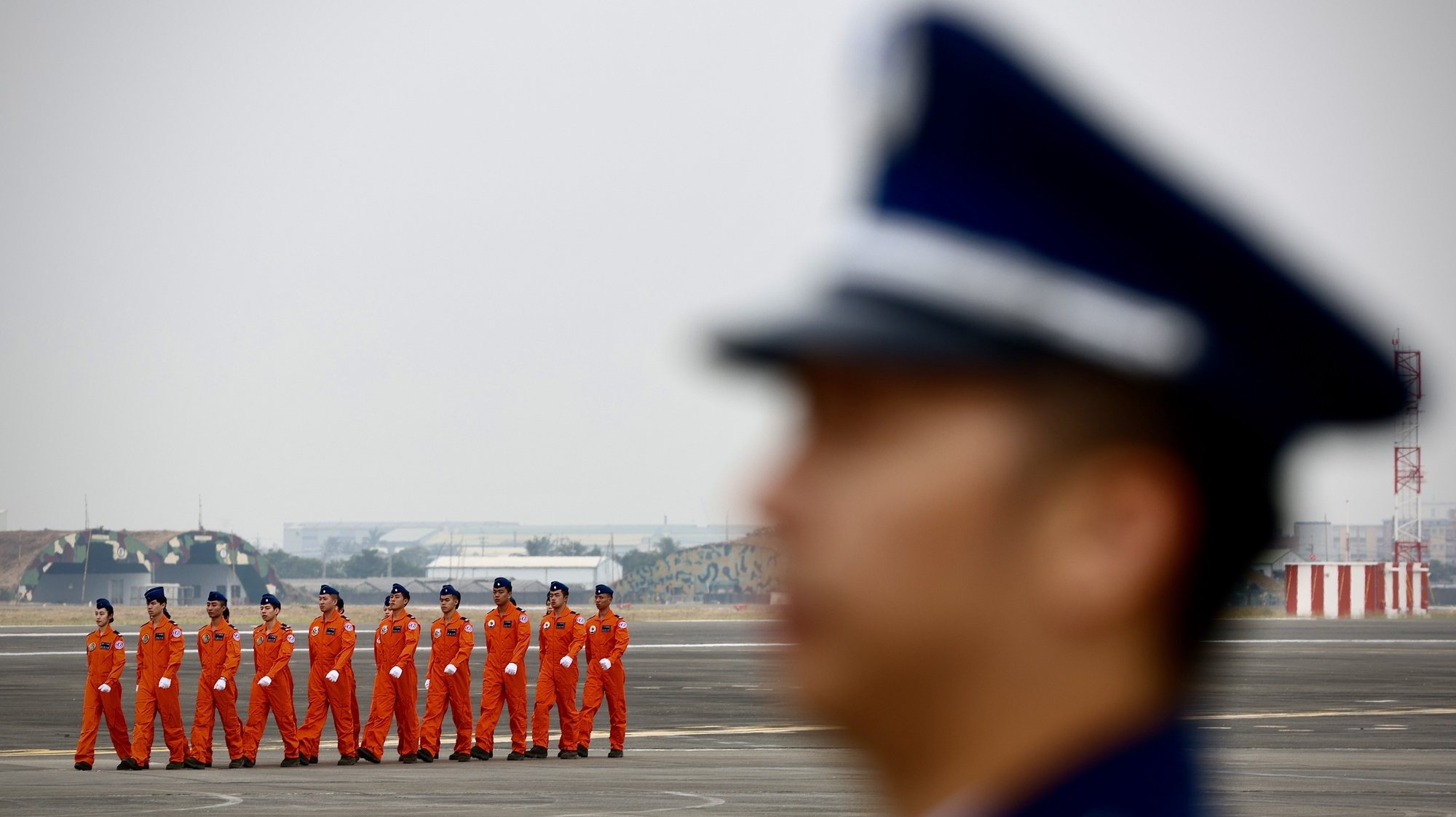 epaselect epa11005214 Taiwan Air Force pilots walk on the tarmac during the Air Force Flight Training Command Formation Ceremony at an airbase in Kaohsiung, Taiwan, 01 December 2023. As part of the ongoing military tension between China and Taiwan, there&#039;s been a notable increase in Chinese military aircraft incursions into Taiwan&#039;s airspace. The Taiwan Air Force is actively monitoring these situations, and responds by promptly scrambling fighter jets, such as the Mirage-2000 and F-16V, for interceptions. The Taiwan Advanced Jet Trainer (AJT) is being developed in Taiwan to replace the aging fleet of AT-3 and F-5 trainer aircraft.  EPA/RITCHIE B. TONGO