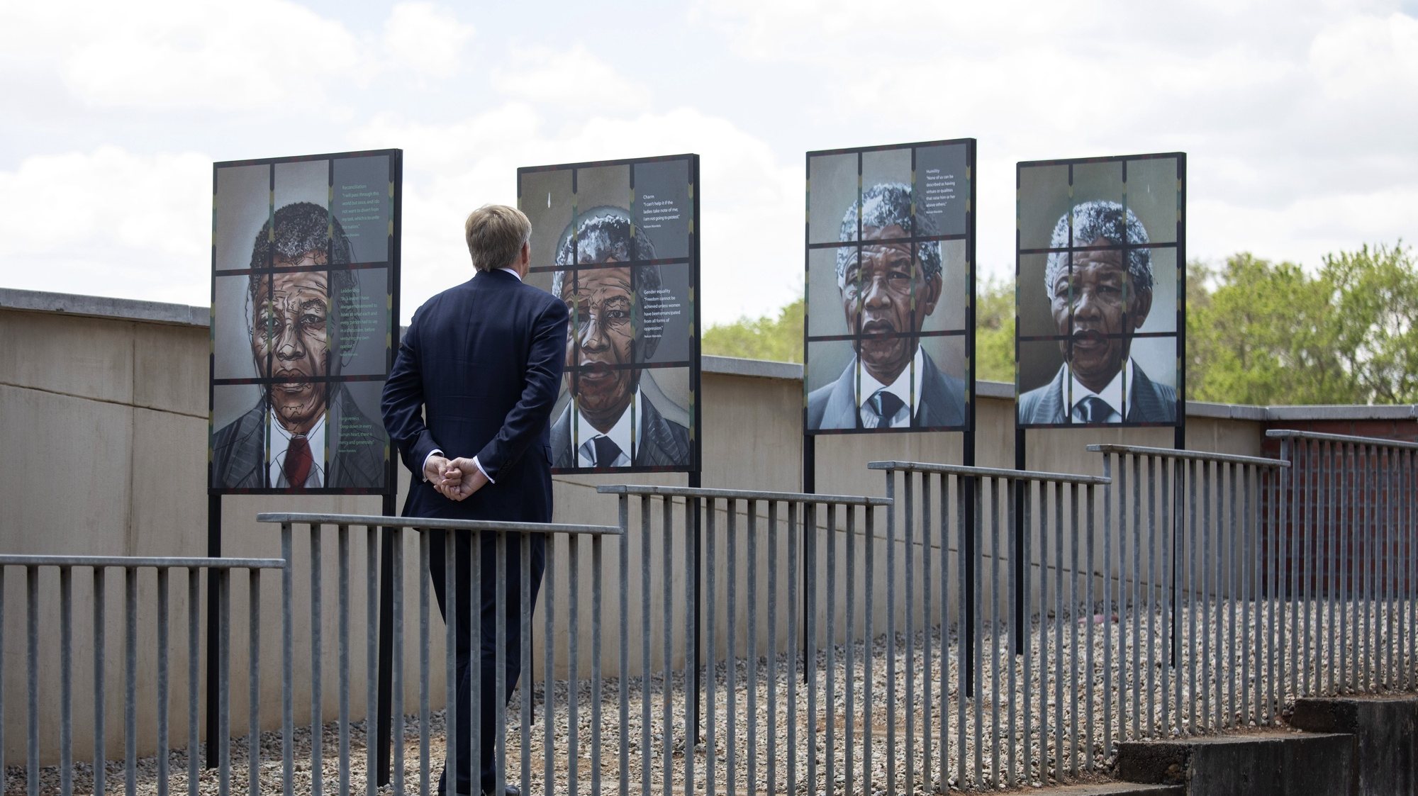 epa10925519 King Willem-Alexander of the Netherlands looks at images of Nelson Mandela during a visit to the Apartheid Museum in Johannesburg, South Africa, 18 October 2023. The Dutch Royal couple is visiting South Africa followed by Kenya.  EPA/KIM LUDBROOK