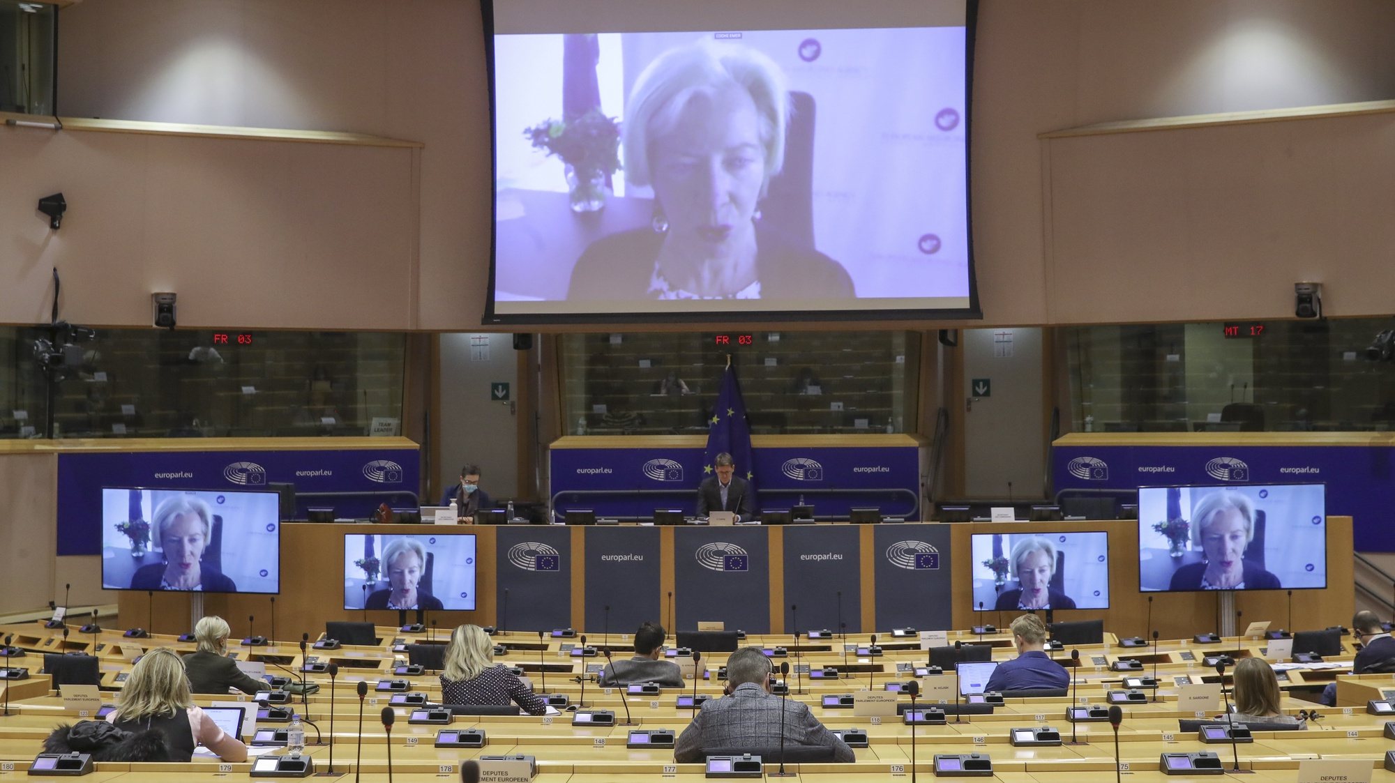 epa09091123 Executive Director of the European Medicines Agency Emer Cooke (on screens) speaks during a video hearing by European Parliament Committee on the Environment, Public Health and Food Safety on the update of evaluation and authorisation of COVID-19 vaccines in Brussels, Belgium, 23 March  2021.  EPA/OLIVIER HOSLET