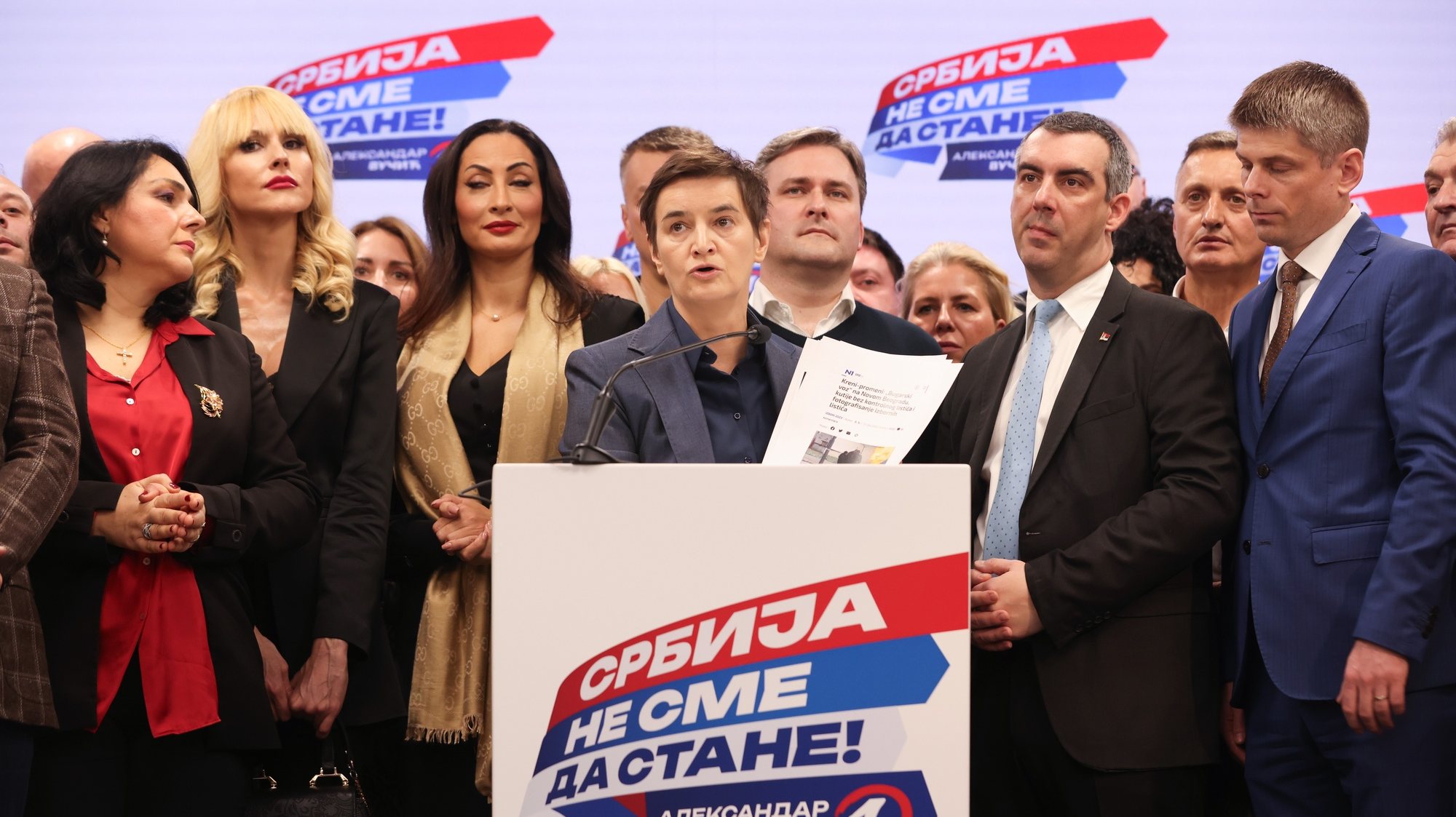 epa11035091 Serbian Prime Minister Ana Brnabic (C) speaks at the SNS election night after the Parliamentary and local elections in Belgrade, Serbia, 17 December 2023. Serbian Prime Minister Ana Brnabic announced to the media that the Serbian Progressive Party SNS had won the parliamentary election in Serbia and secured a majority in the Parliament, based on 50 percent of exit polls.  EPA/ANDREJ CUKIC