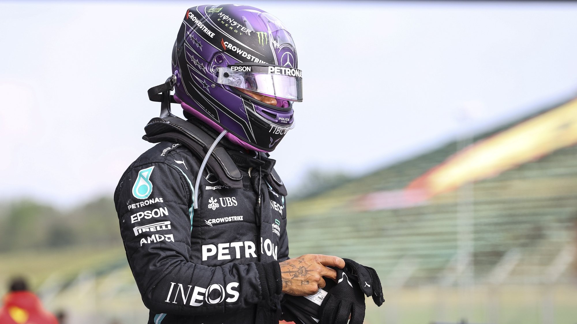 epa09143810 Second placed British Formula One driver Lewis Hamilton of Mercedes-AMG Petronas reacts after the Formula One Grand Prix Emilia Romagna at Imola race track, Italy, 18 April 2021.  EPA/Bryn Lennon / POOL