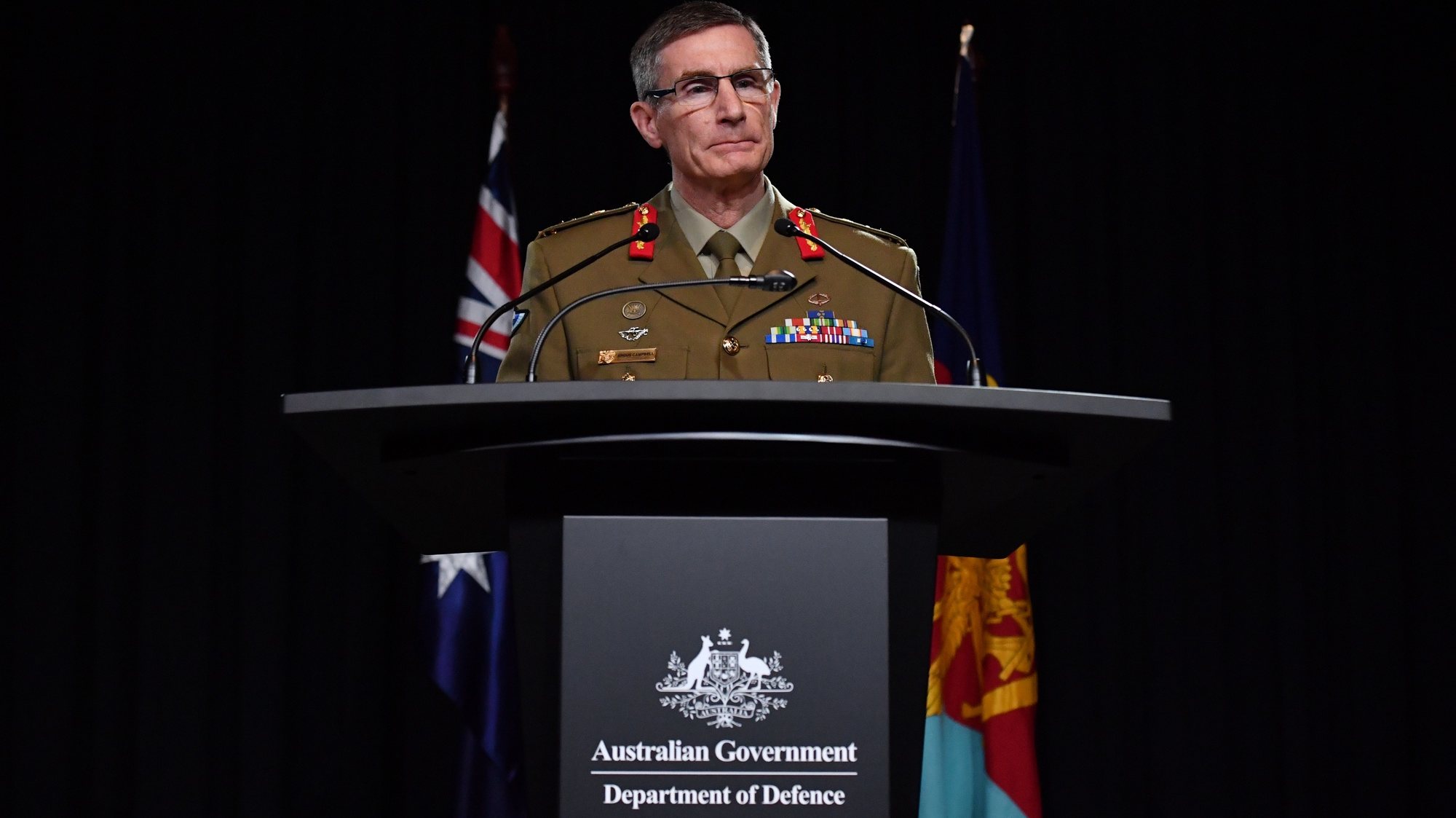 epa08828545 Chief of the Australian Defence Force (ADF) General Angus Campbell delivers the findings from the Inspector-General of the Australian Defence Force Afghanistan Inquiry, in Canberra, Australia, 19 November 2020. A landmark report has shed light on alleged war crimes by Australian troops serving in Afghanistan.  EPA/MICK TASIKAS AUSTRALIA AND NEW ZEALAND OUT