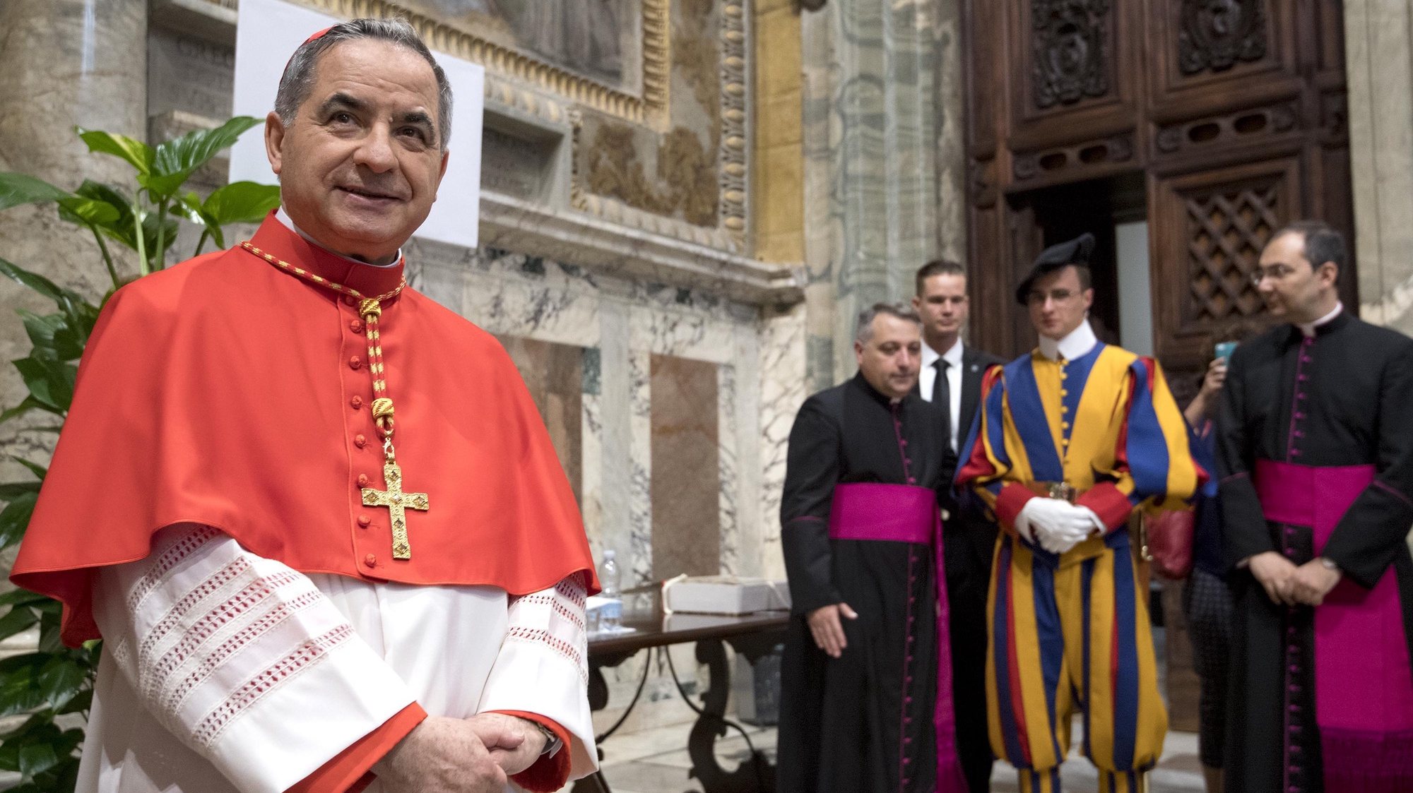 epa06848346 Substitute of the Vatican Secretary of State and Special Delegate for the Sovereign Military Order of Malta from Italy, Giovanni Angelo Becciu (L) poses for photographers after the Pope Francis&#039; Ordinary Public Consistory mass to create 14 new cardinals from 11 countries in Saint Peters Basilica at the Vatican, 28 June 2018. The cardinals-designate are from Bolivia, Iraq, Italy, Japan, Pakistan, Poland, Portugal, Peru, Madagascar, Mexico and Spain.  EPA/CLAUDIO PERI
