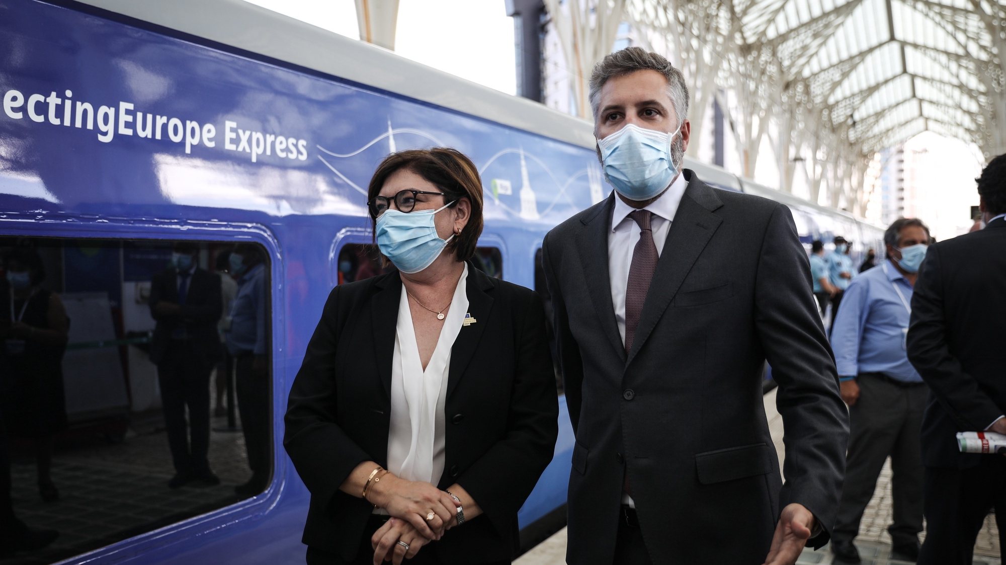 epa09443294 European Commissioner for Transports Adina Valean (L) and Portuguese Minister of Infrastructure and Housing Pedro Nuno Santos (R) moments before the train departure during the Connecting Europe Express ceremony in Gare do Oriente train station in Lisbon, Portugal, 02 September 2021.  EPA/RODRIGO ANTUNES