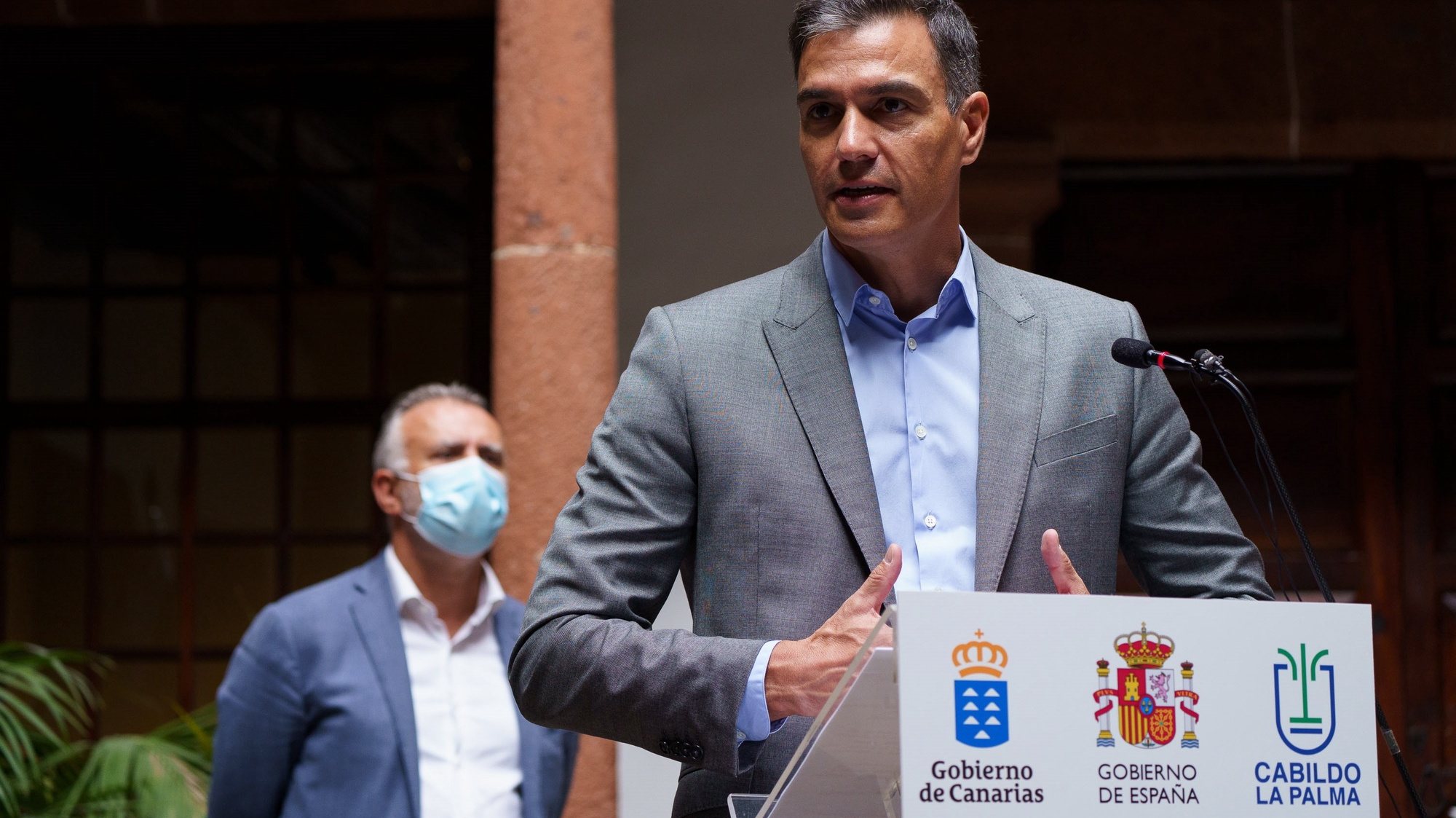 epa09485385 Spanish Prime minister Pedro Sanchez (R) and Canary Islands regional president Angel Victor Torres (L) during the press conference after their work meeting held at Santa Cruz de La Palma, Canary Islands, Spain on 24 September 2021 to evaluate the damages caused by the Cumbre Vieja volcano. The volcano began to erupt in Rajada Mountain in the municipality of El Paso on 19 September. The area had registered hundreds of small earthquakes along the week as magma pressed the subsoil on its way out, urging the regional authorities to evacuate locals before the eruption took place.  EPA/Ramon de la Rocha