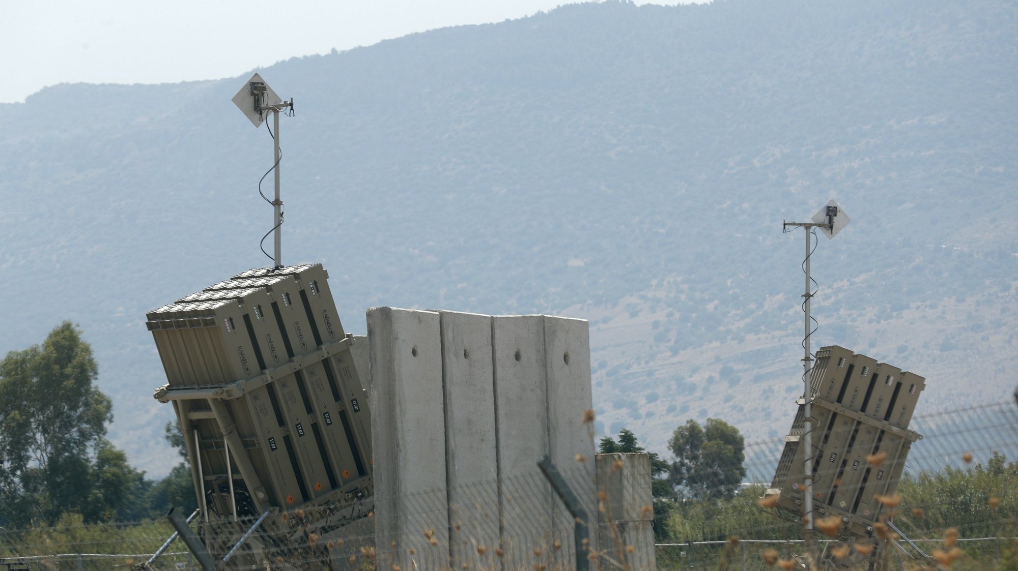 epa09397776 Israeli Iron dome anti-missile battery deployed in the north of Galilee, near the Israeli border with Lebanon 05 August 2021. Tensions continues on the Israeli-Lebanon border after Israeli army responded by artillery and airstrike of Lebanese targets after three rockets were fired from Lebanon into Israeli territory on 04 August.  EPA/ATEF SAFADI