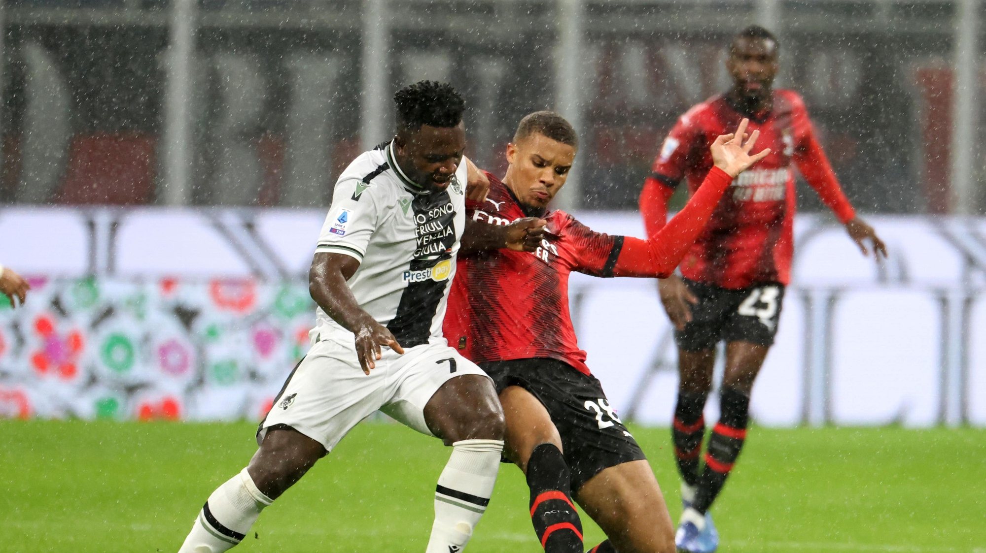 epa10958548 Udinese’s Isaac Success (L) in action against AC Milan’s Malick Thiaw during the Italian serie A soccer match between AC Milan and Udinese at Giuseppe Meazza stadium in Milan, Italy, 04 November 2023.  EPA/MATTEO BAZZI