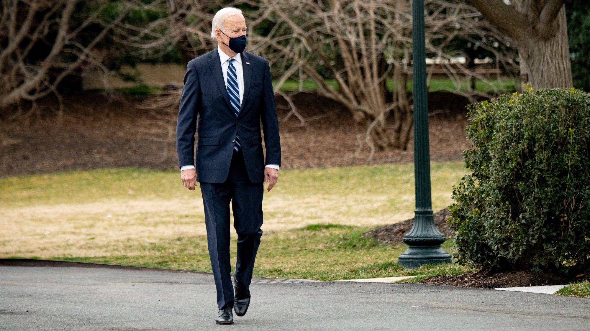 epa09078510 US President Joe Biden walks on the South Lawn of the White House before boarding Marine One in Washington, DC, USA, 16 March 2021. Biden, traveling to Pennsylvania, is fanning out across the country along with the Vice President and their spouses to highlight Americans receiving stimulus checks and coronavirus vaccines, as well as businesses that have been able to stay afloat with government loans.  EPA/ERIN SCOTT / POOL