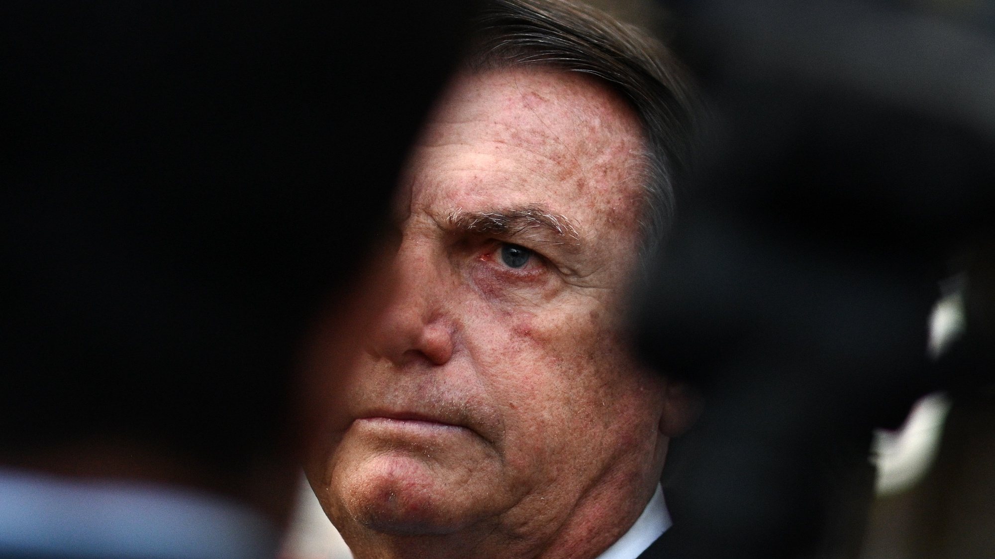 epa10742610 Former Brazilian President Jair Bolsonaro makes a statement after leaving the headquarter of the Federal Police in Brasilia, Brazil, 12 July 2023. Bolsonaro presented his testimony in a case of alleged coup denounced by Brazilian right-wing senator Marcos do Val.  EPA/Andre Borges