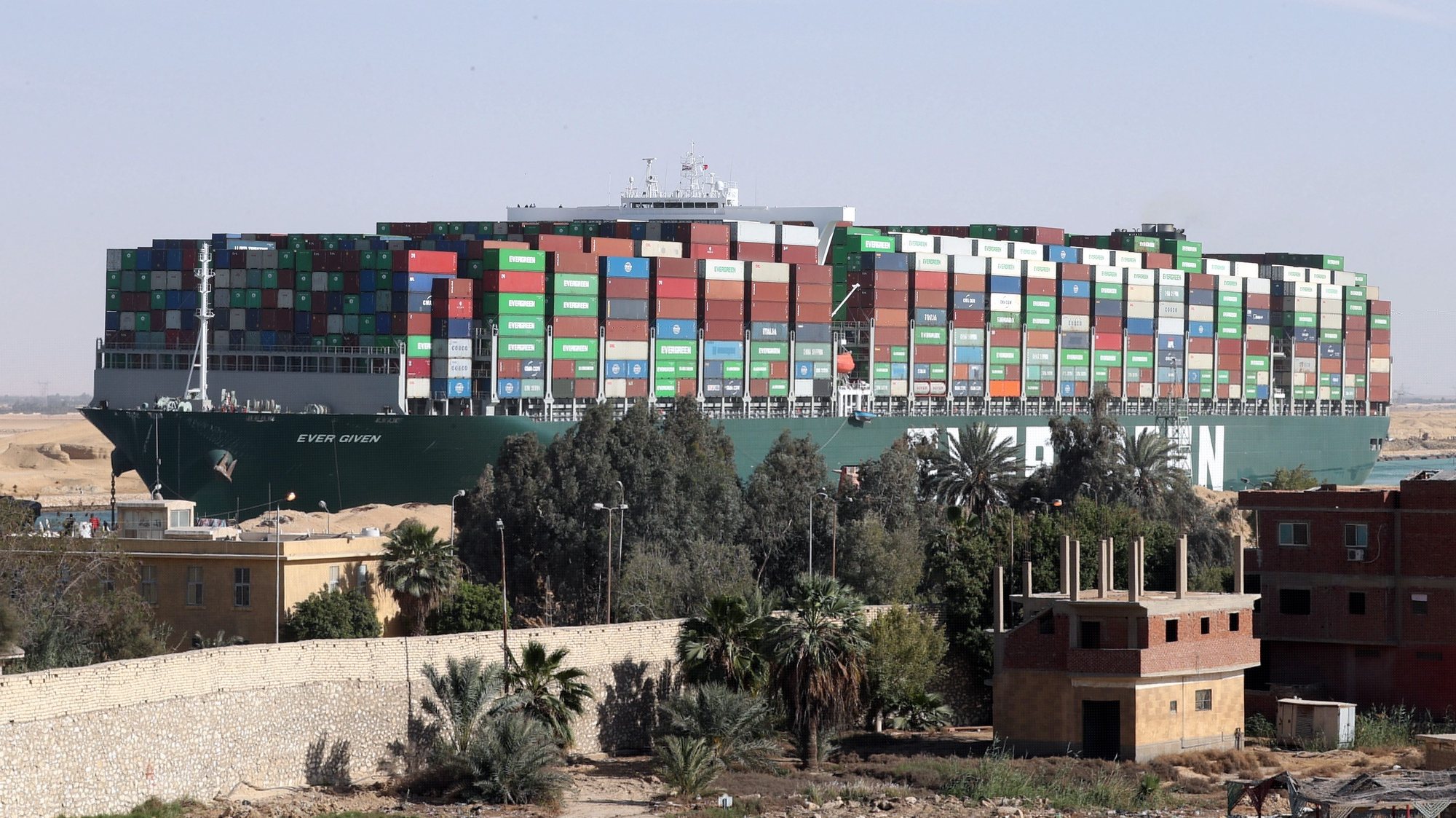 epa09134869 (FILE) - The container ship &#039;Ever Given&#039; is moving in the Suez Canal, Egypt, 29 March 2021 (reissued 14 April 2021). The Suez Canal Authority (SCA) has seized the ship over an unsettled claim of over 900 Million US dollars for compensation, the Ever Given&#039;s insurer UK Club said. The Ever Given ran aground in the Suez Canal on 23 March, causing a huge traffic backlog of ships.  EPA/KHALED ELFIQI *** Local Caption *** 56794878