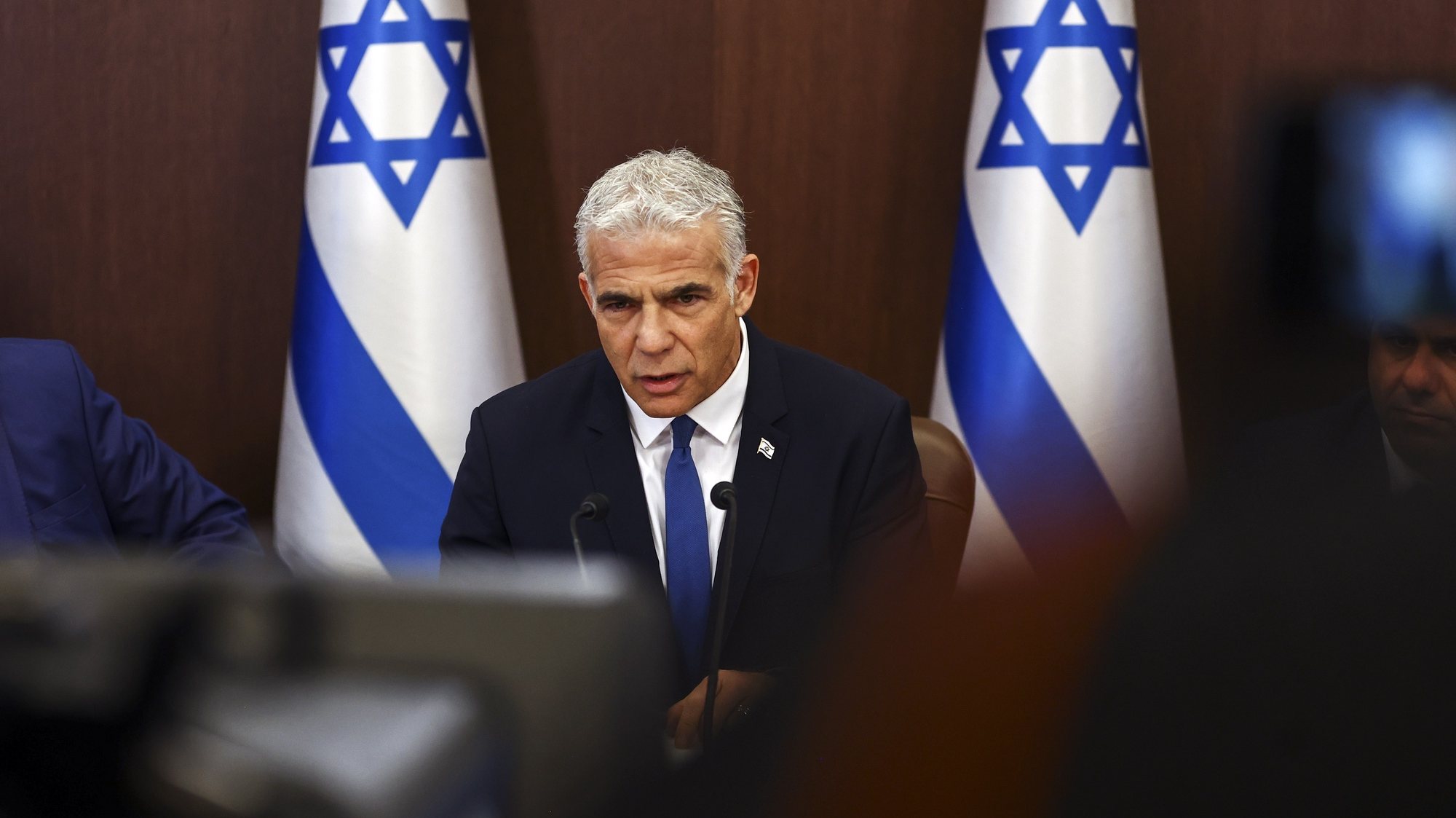 epa10089404 Israeli Prime Minister Yair Lapid speaks during a weekly cabinet meeting at the prime minsterÃ•s office in Jerusalem, 24 July 2022.  EPA/RONEN ZVULUN / POOL