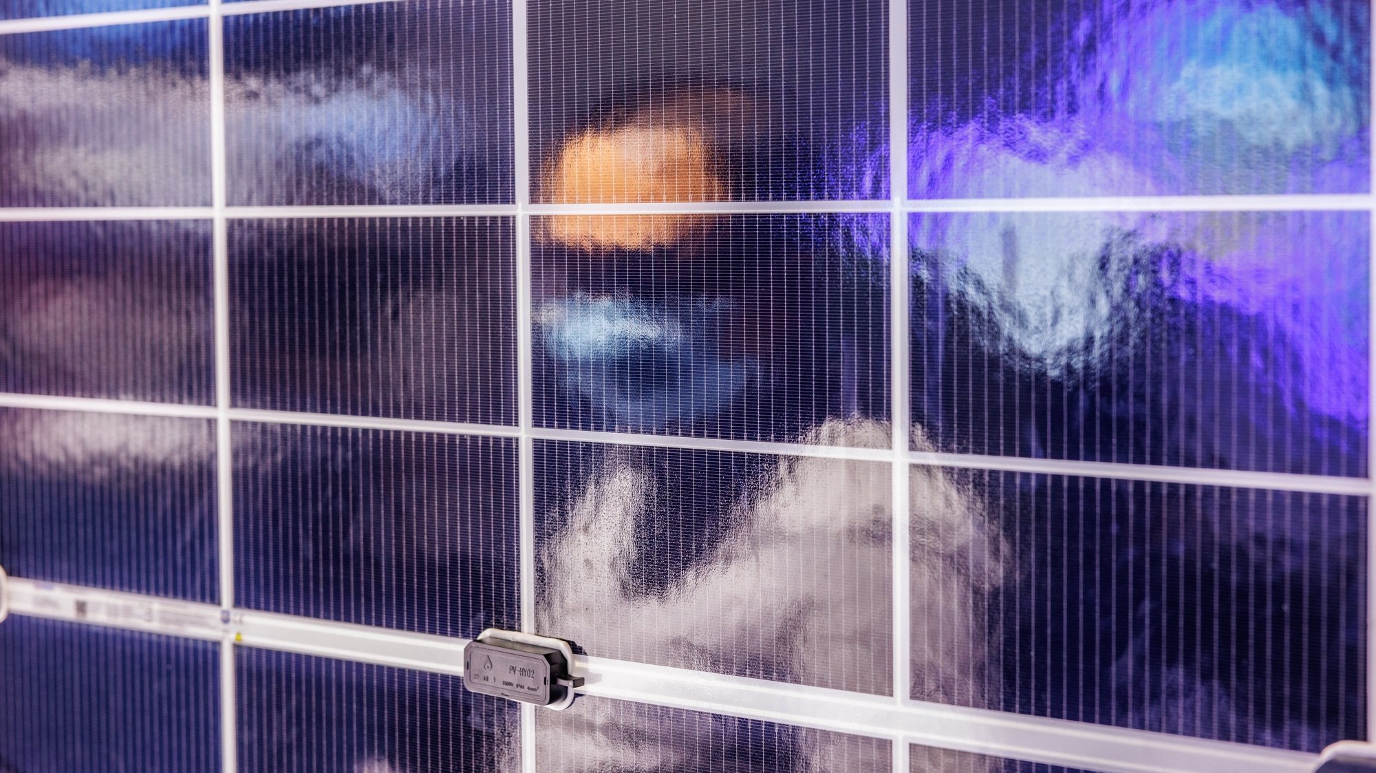 epa10650140 A man is reflected on solar panel during the SNEC PV Power Expo, in Shanghai, China, 24 May 2023. World&#039;s biggest solar energy expo is running between 24 and 26 May in Shanghai. SNEC International Photovoltaic Power Generation and Smart Energy Conference and Exhibition attracts hundreds of thousands of domestic and international visitors after three years of COVID-19-related travel restrictions.  EPA/ALEX PLAVEVSKI