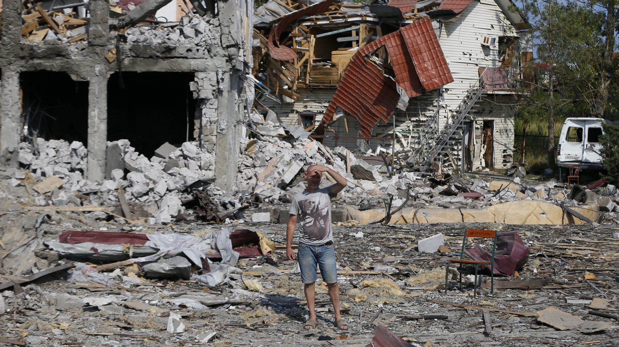 epaselect epa10127654 A local man inspects debris of private buildings and recreation center after a recent rocket hit in Zatoka settlement near the South Ukrainian city of Odesa, 18 August 2022, amid the Russian invasion. At least four people were injured, according to the State Emergency Service. Russian troops on 24 February entered Ukrainian territory, starting a conflict that has provoked destruction and a humanitarian crisis.  EPA/STR