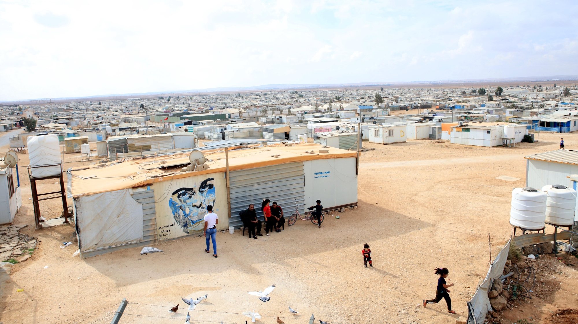 epa09592057 A general view of the Zaatari refugee camp, Jordan, 19 November 2021. According to latest UNHCR data, the Zaatari camp, the largest of two camps in Jordan, is currently hosting 79,978 registered Syrian refugees.  EPA/MOHAMMAD ALI