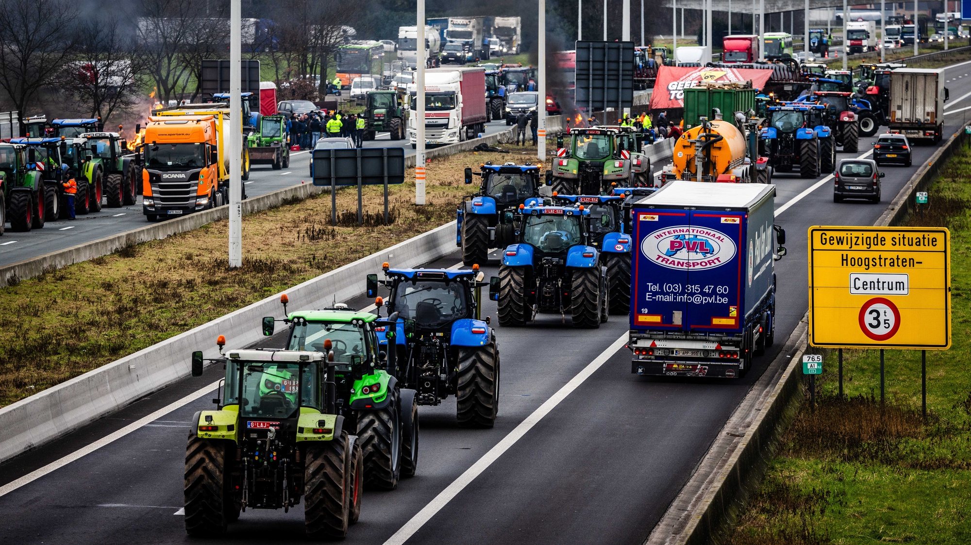 epa11119759 Dutch and Belgian farmers with tractors block the border crossing at Hazeldonk, between the Netherlands and Belgium, 02 February 2024. The farmers demonstrate against agricultural rules that they believe are too strict and unfair competition within European borders.  EPA/JEFFREY GROENEWEG