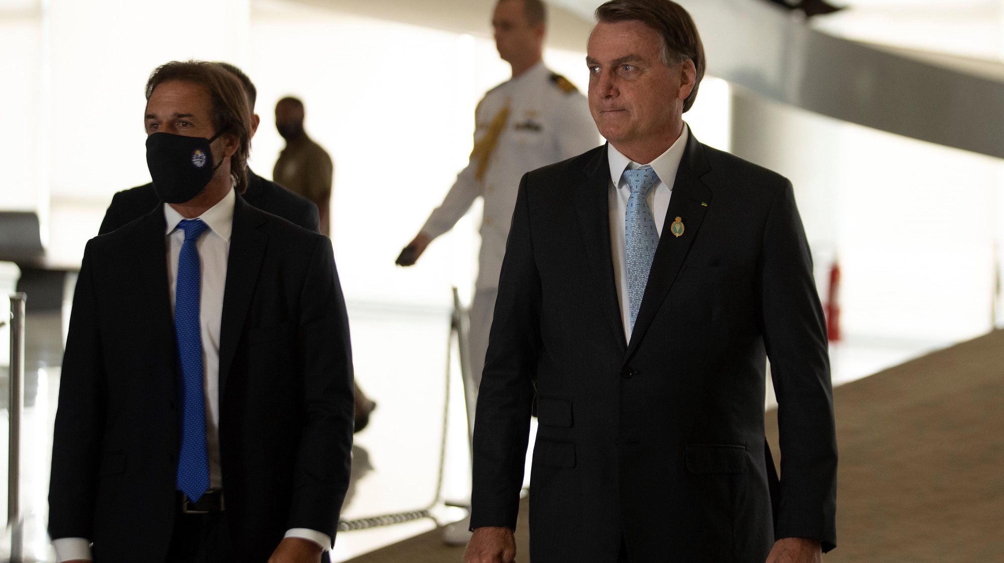 epa08984990 The president of Brazil, Jair Bolsonaro (R) and the president of Uruguay, Luis Lacalle Pou (L) meet at the Planalto Palace, in Brasilia, Brazil, 03 February 2021. The president of Uruguay, Luis Lacalle Pou, was received on 03 February by his Brazilian counterpart, Jair Bolsonaro, for a private meeting in which they will discuss bilateral and regional issues, of commercial and economic content.  EPA/Joedson Alves