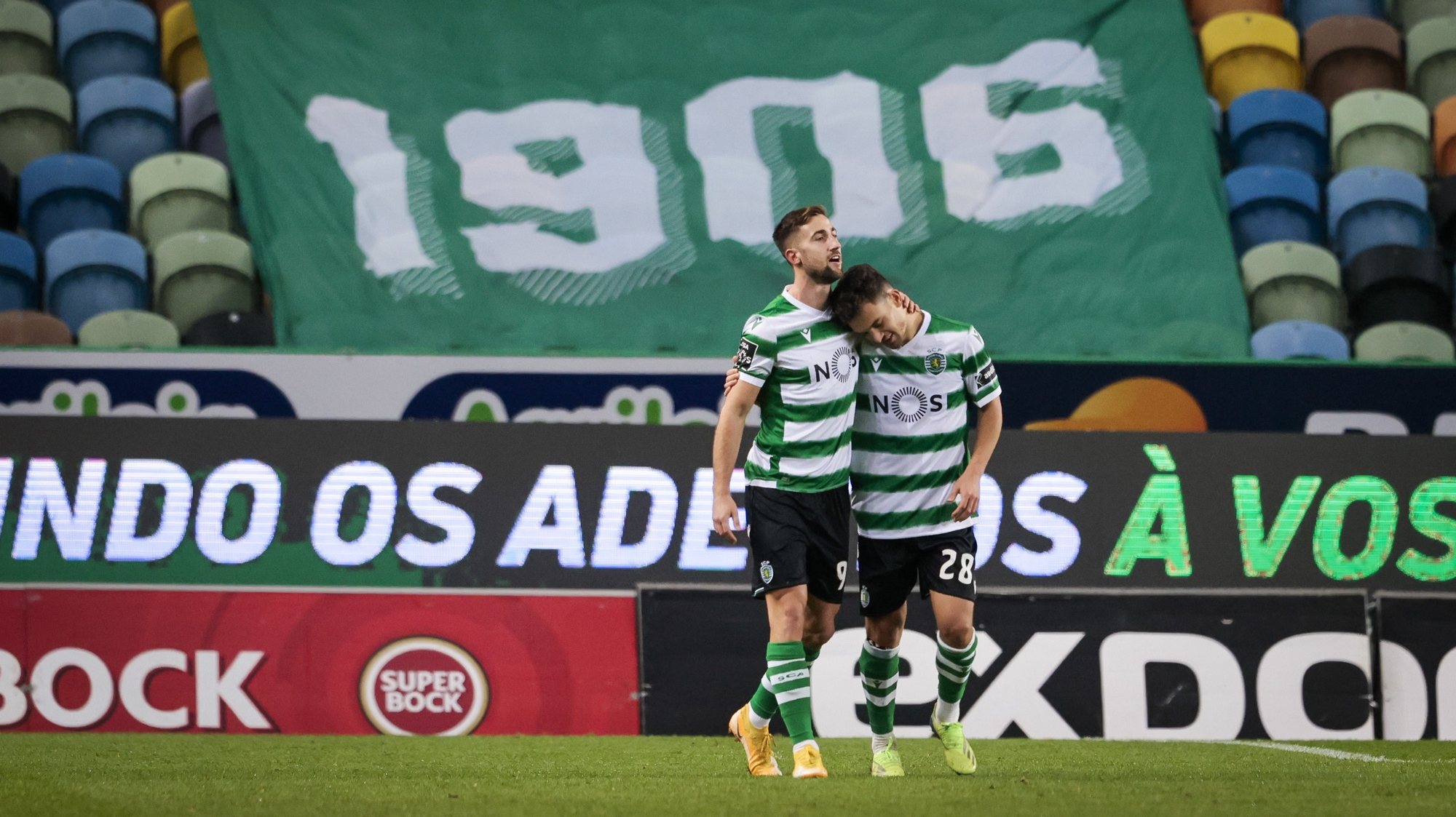 Sporting player Andraz Sporar (L) celebrates after scoring a goal during the Portuguese First League soccer match between Sporting and Farense, held at Alvalade Stadium in Lisbon, Portugal, 19 December 2020. JOSE SENA GOULAO/LUSA